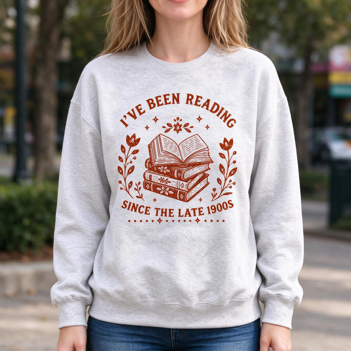 Model wearing the I've Been Reading Since The Late 1900s sweatshirt in Ash, lifestyle image 1
