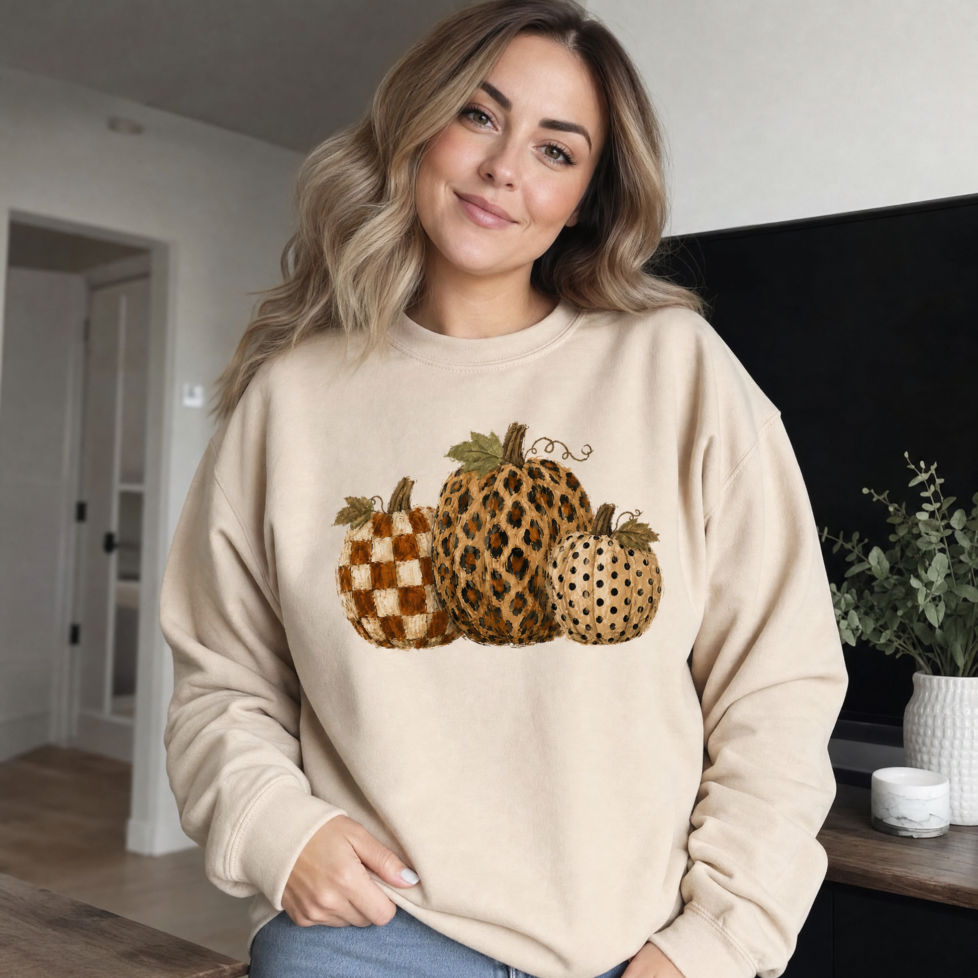 Model wearing the Leopard Polka Dot Pumpkins sweatshirt in Sand
