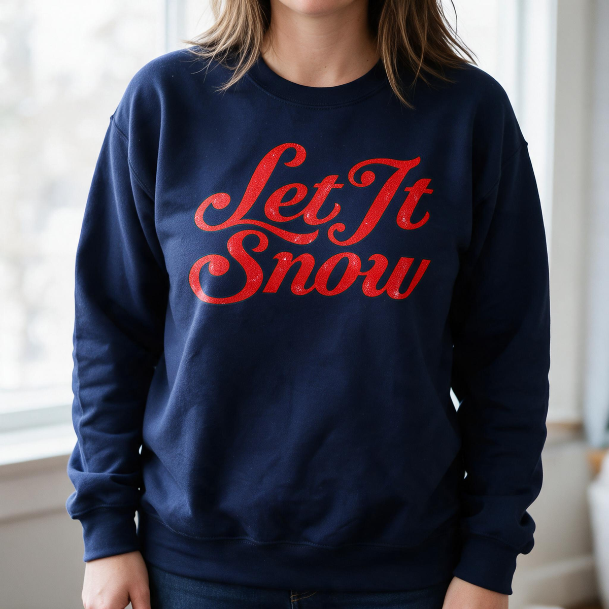 Model wearing the Let It Snow sweatshirt in Navy, lifestyle image 1