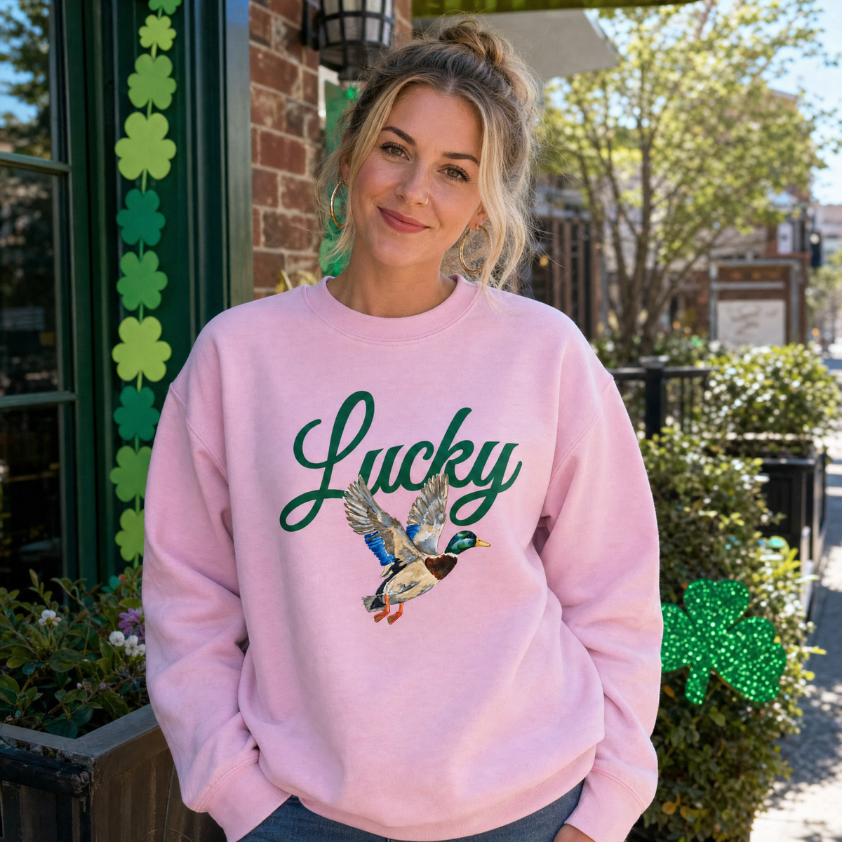 Model wearing the Lucky Mallard Duck sweatshirt in Light Pink