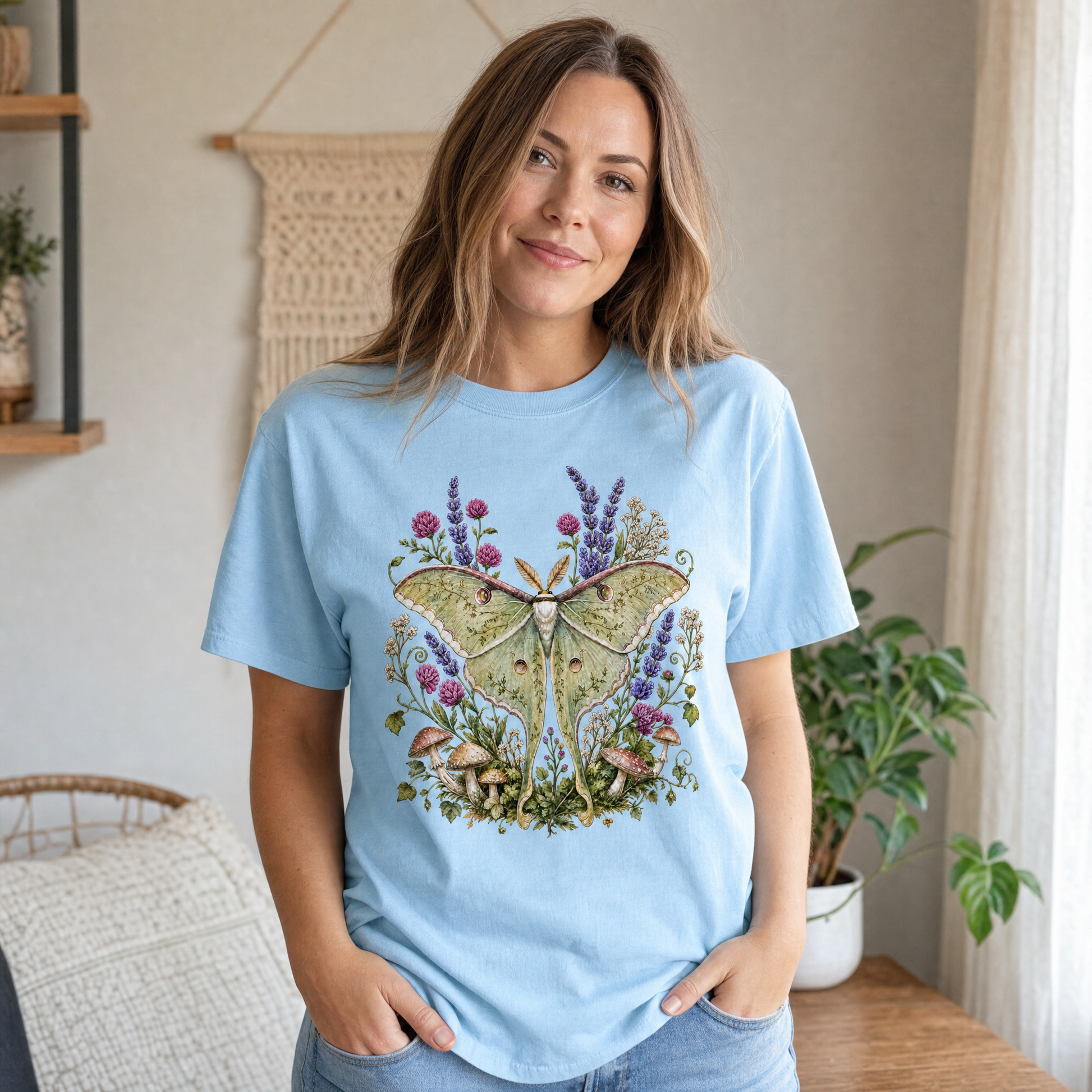 Model wearing the Luna Moth comfort colors tee in Chambray