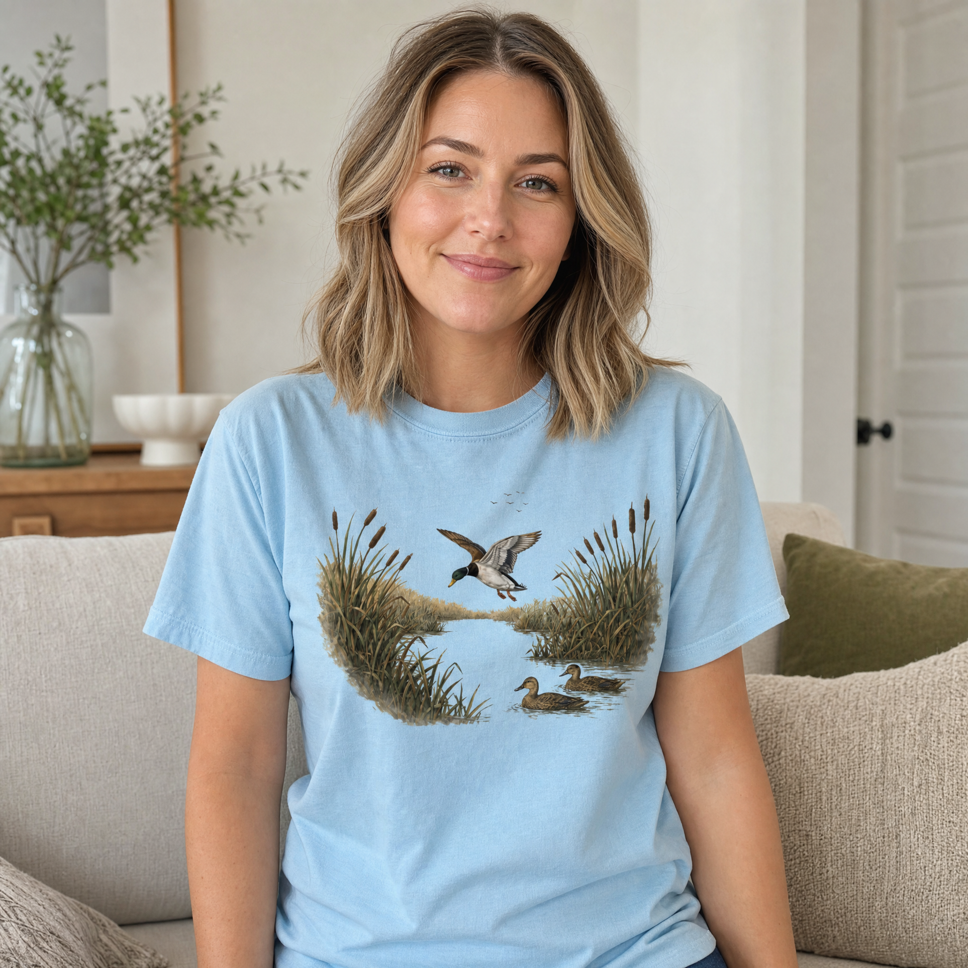Model wearing the Mallard Ducks comfort colors tee in Chambray