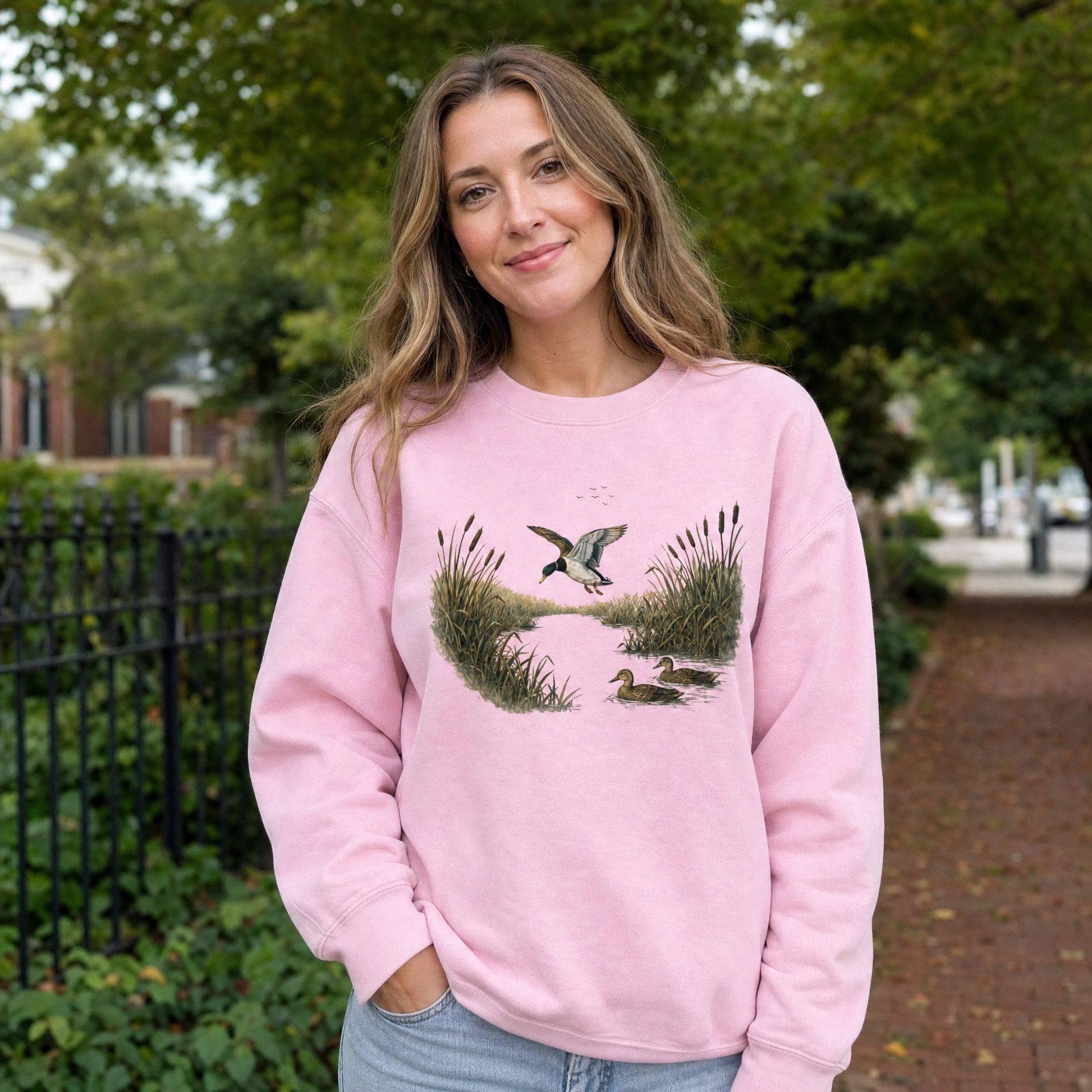 Model wearing the Mallard Ducks sweatshirt in Light Pink