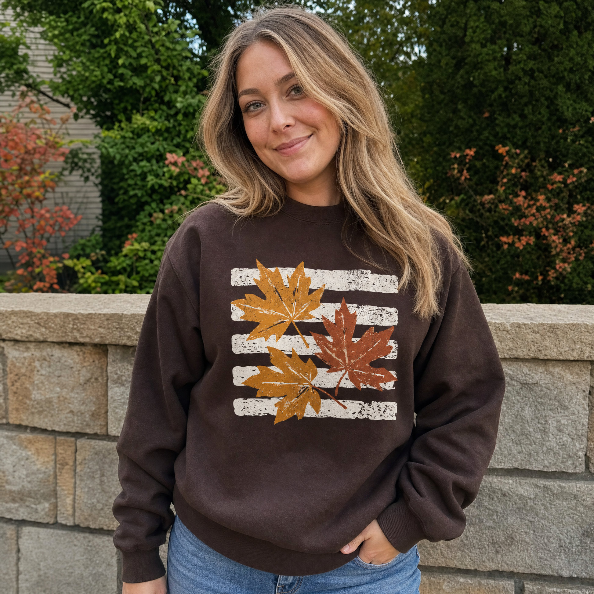 Model wearing the Maple Leaves sweatshirt in Dark Chocolate, lifestyle image 1