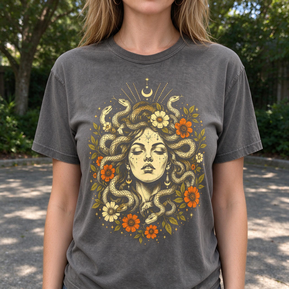 Model wearing the Medusa Goddess comfort colors tee in Pepper, lifestyle image 1