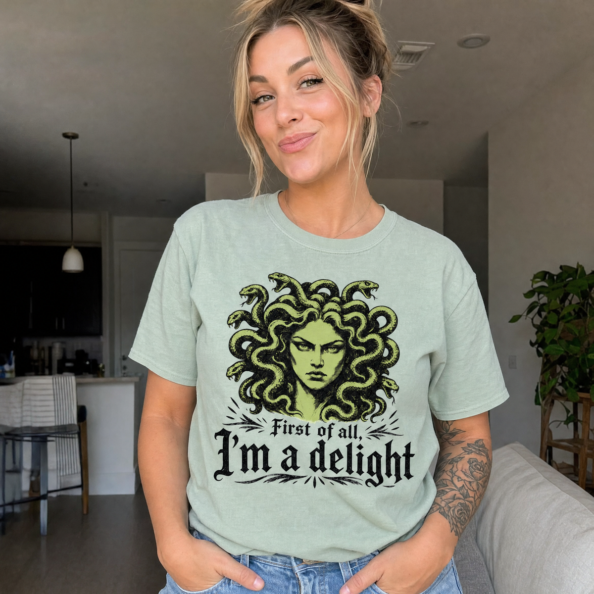 Model wearing the Medusa comfort colors tee in Bay