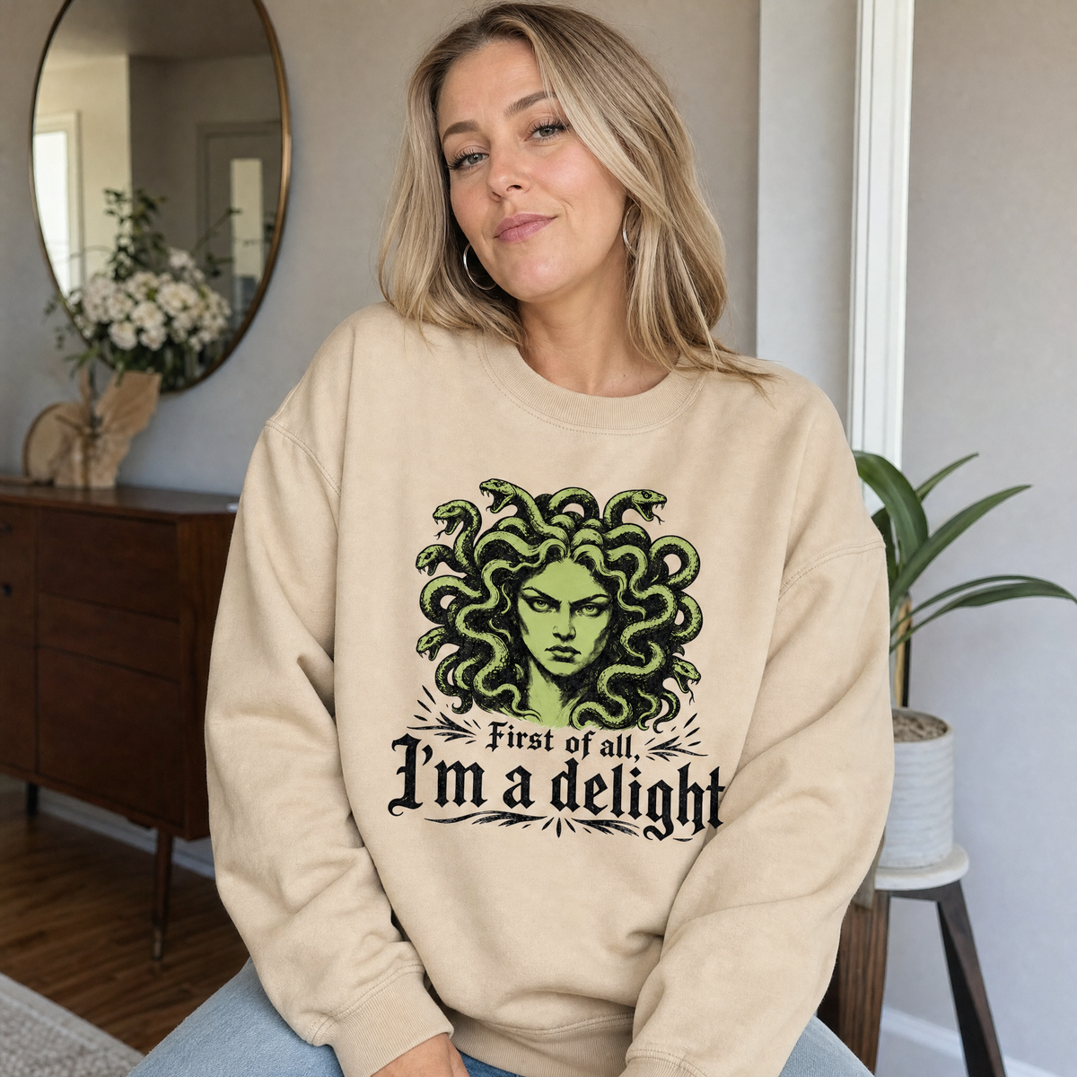Model wearing the Medusa sweatshirt in Sand