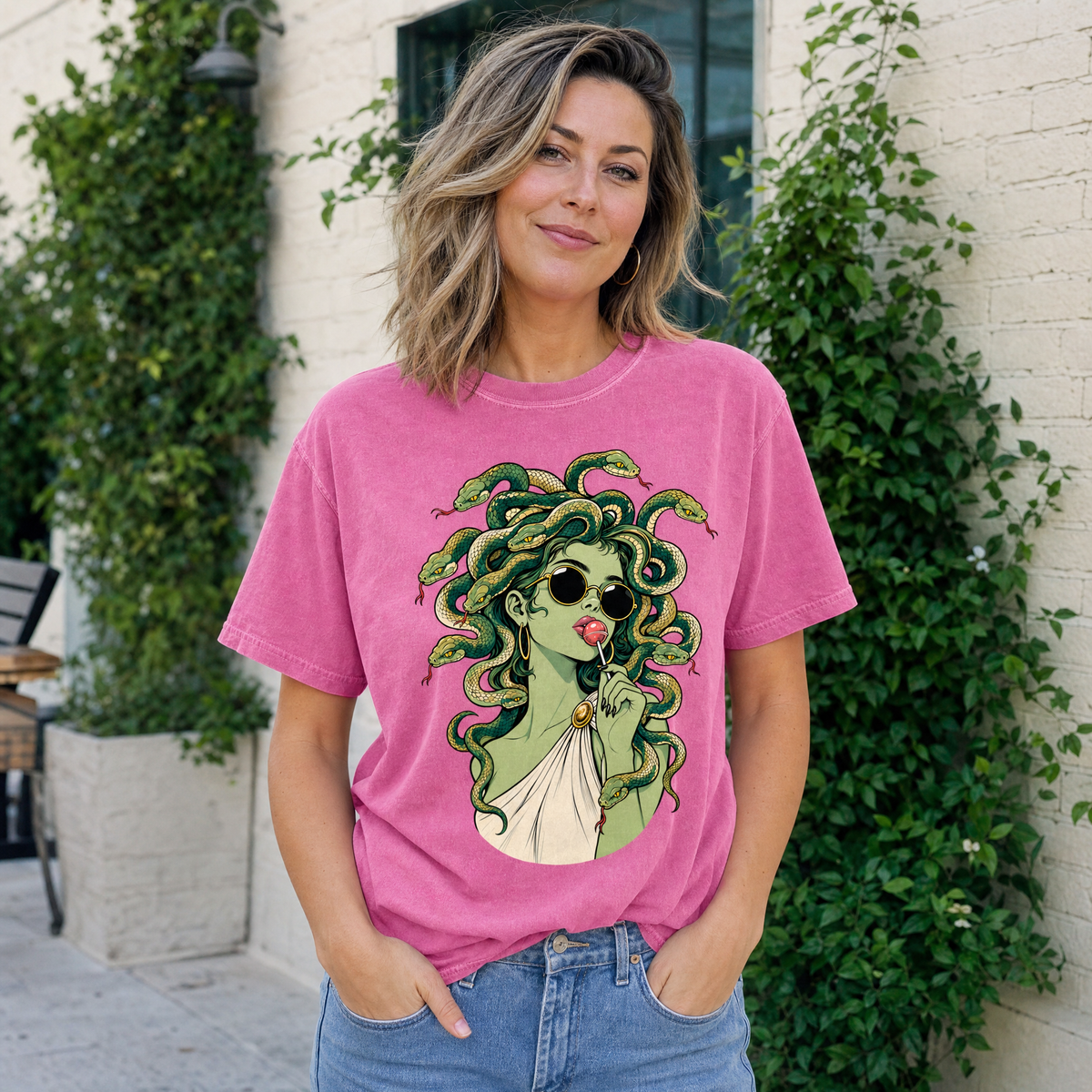 Model wearing the Medusa With Lollipop comfort colors tee in Crunchberry
