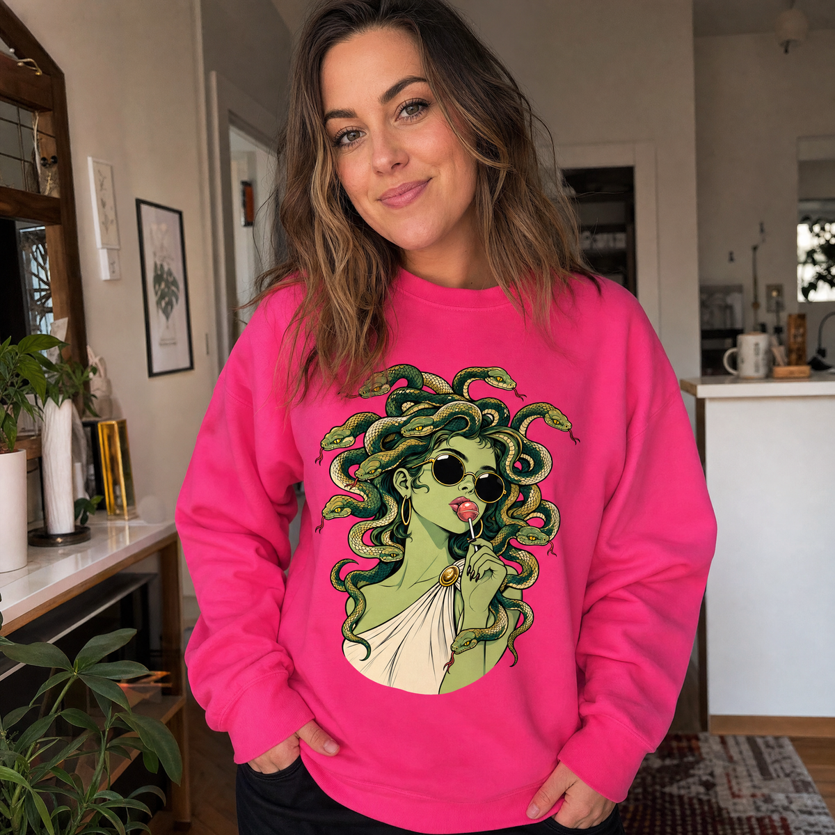 Model wearing the Medusa With Lollipop sweatshirt in Heliconia