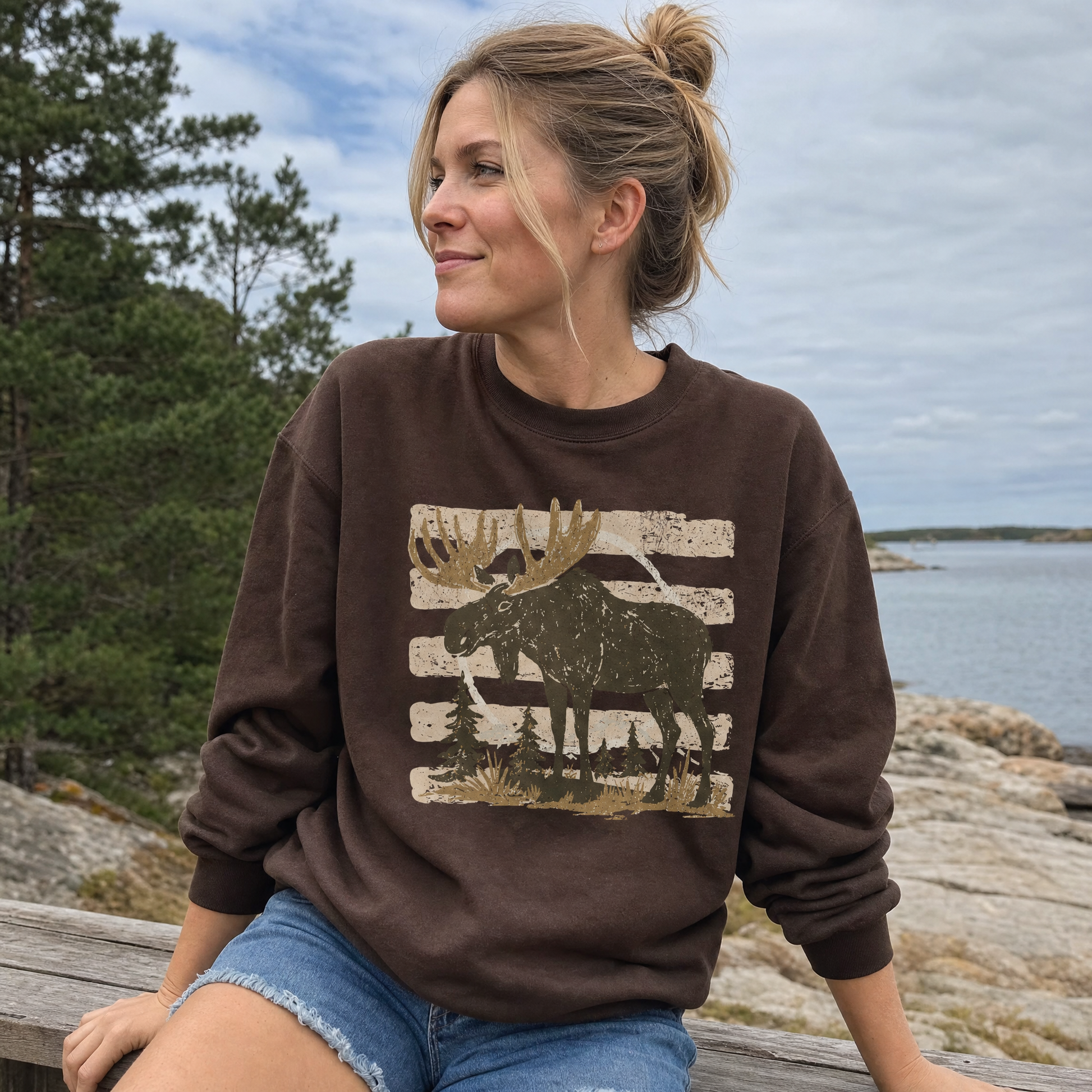 Model wearing the Moose sweatshirt in Dark Chocolate, lifestyle image 1