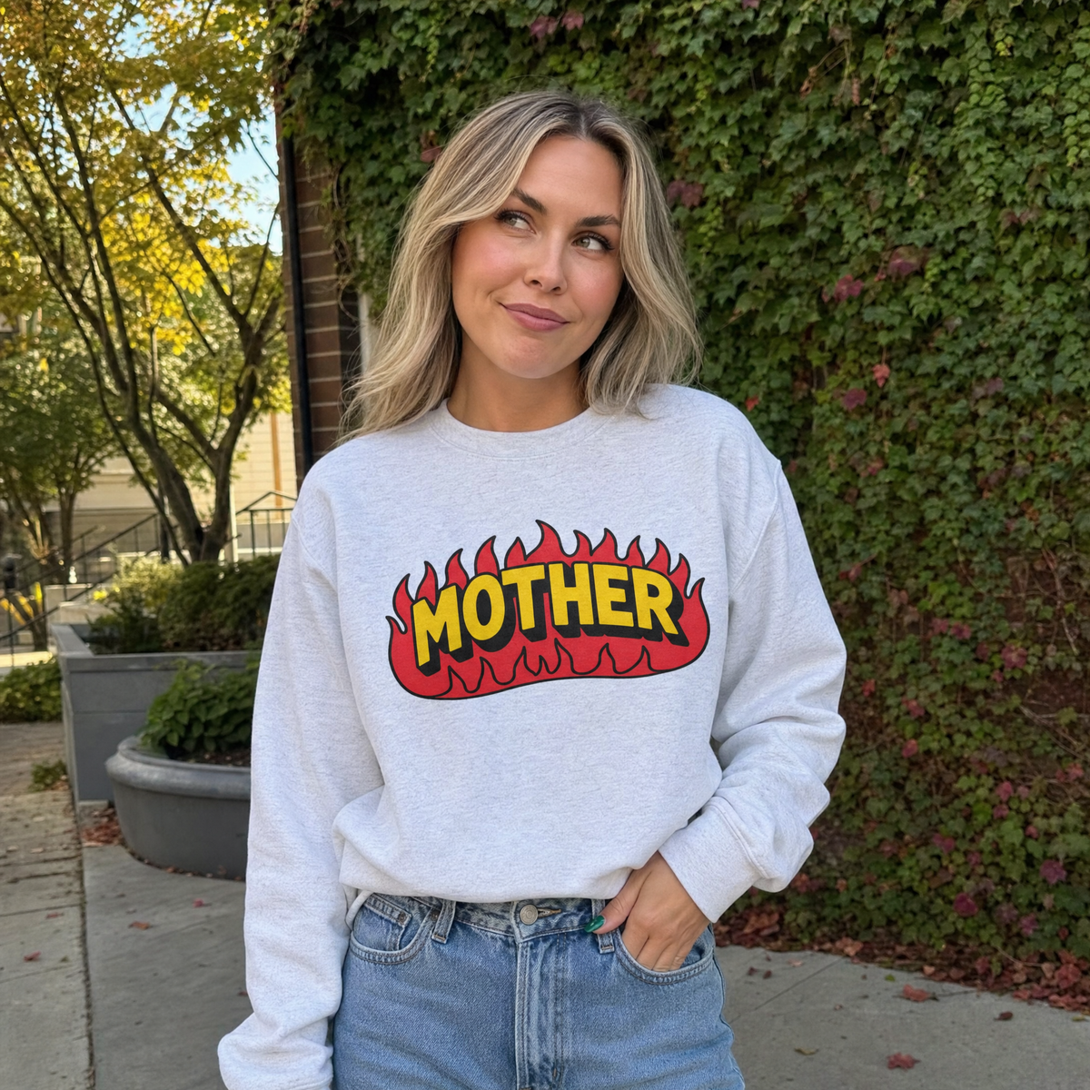 Model wearing the Mother Flaming Text sweatshirt in Ash
