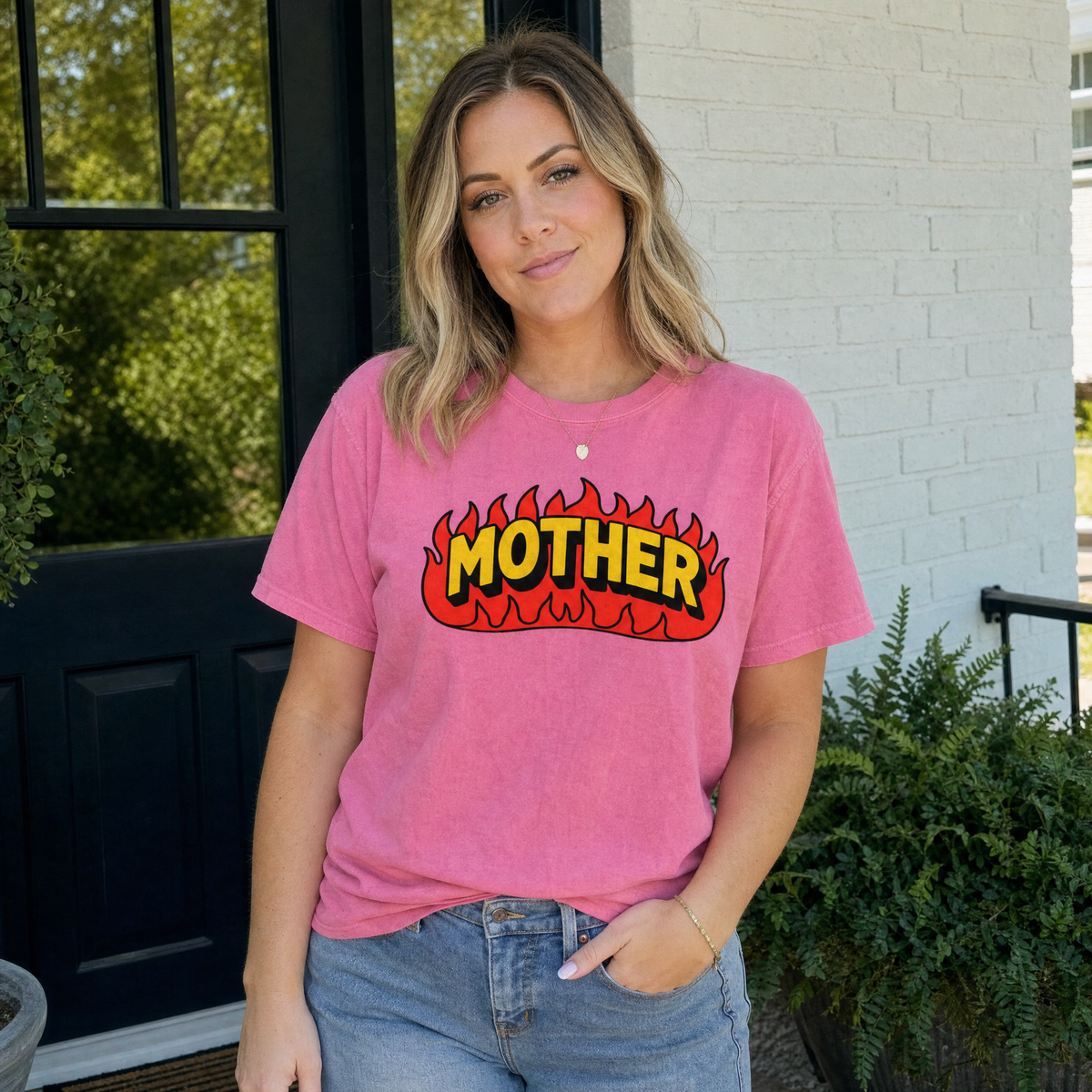 Model wearing the Mother Flaming Text comfort colors tee in Crunchberry