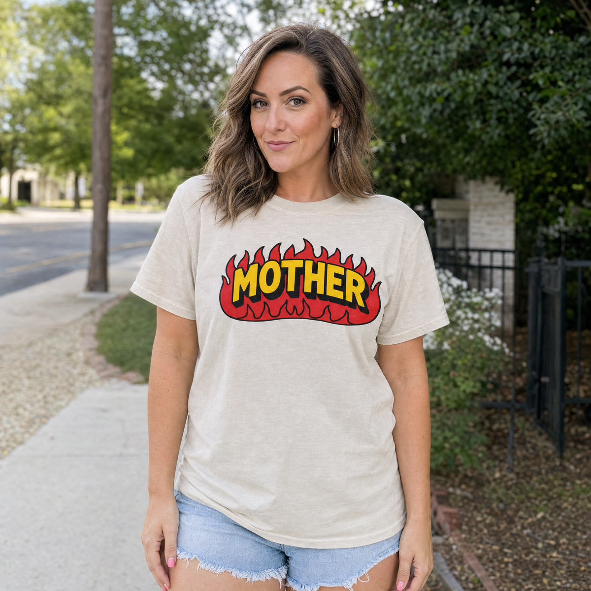 Model wearing the Mother Flaming Text comfort colors tee in Ivory