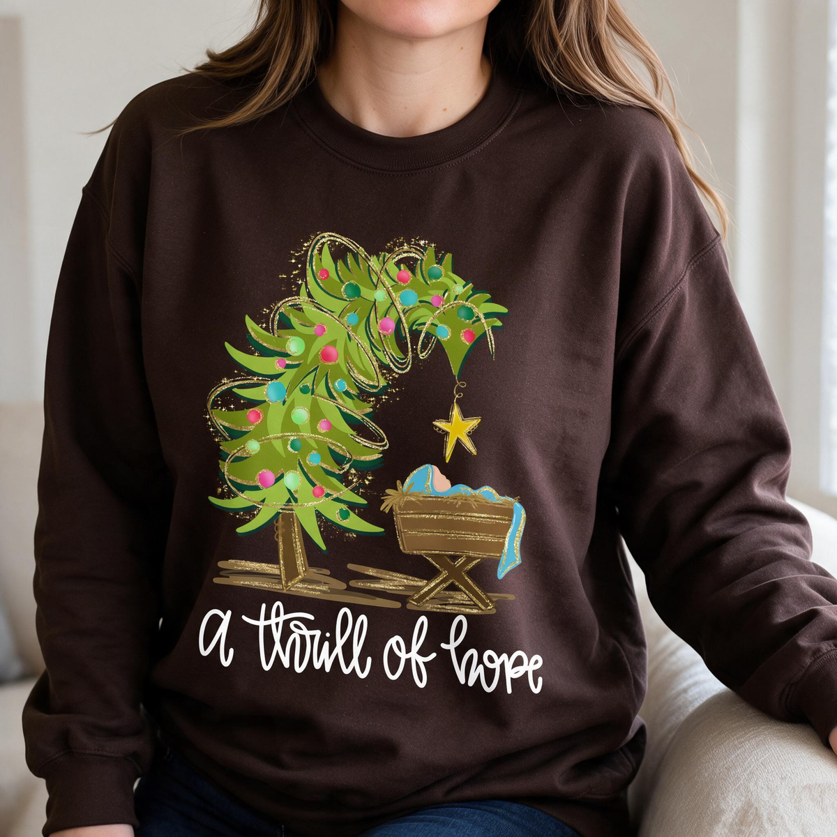 Model wearing the Nativity Scene sweatshirt in Dark Chocolate