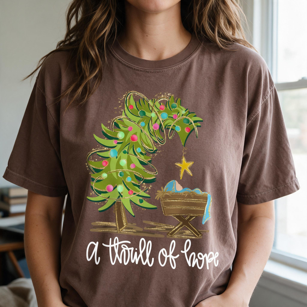 Model wearing the Nativity Scene comfort colors tee in Espresso