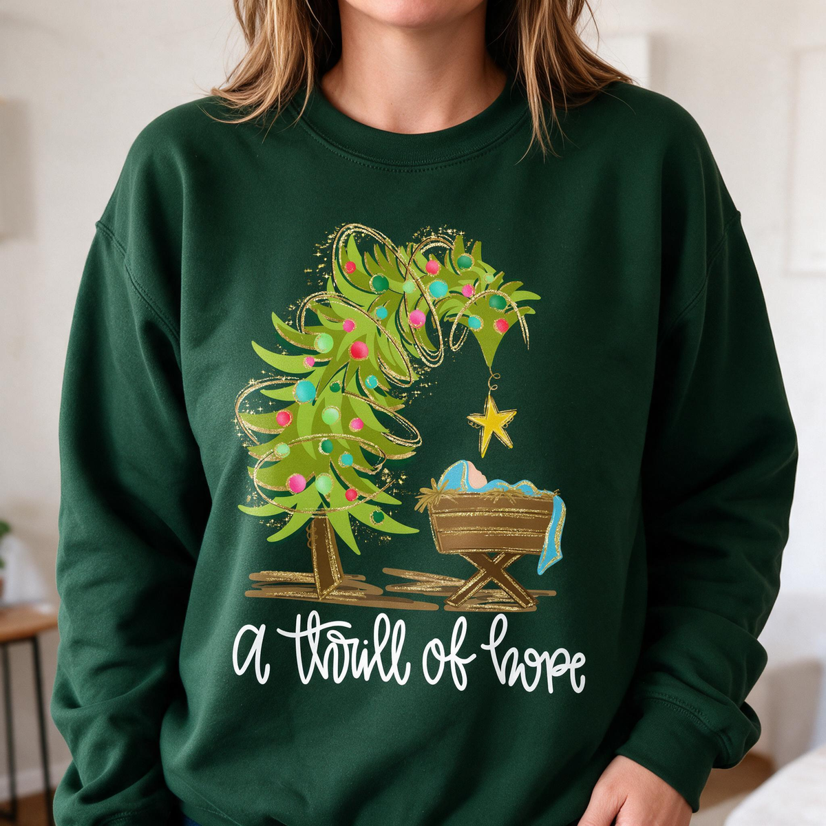 Model wearing the Nativity Scene sweatshirt in Forest Green, lifestyle image 1