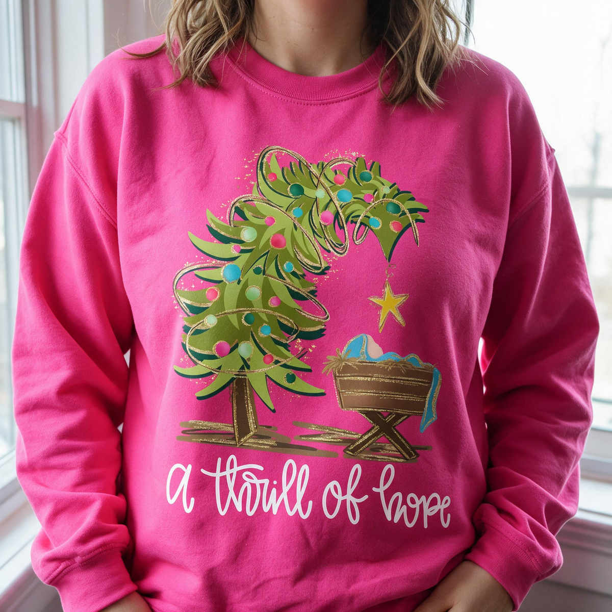 Model wearing the Nativity Scene sweatshirt in Heliconia