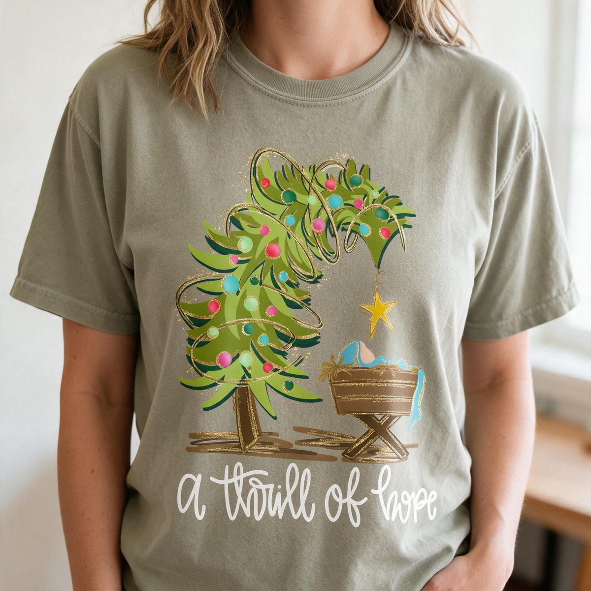 Model wearing the Nativity Scene comfort colors tee in Khaki
