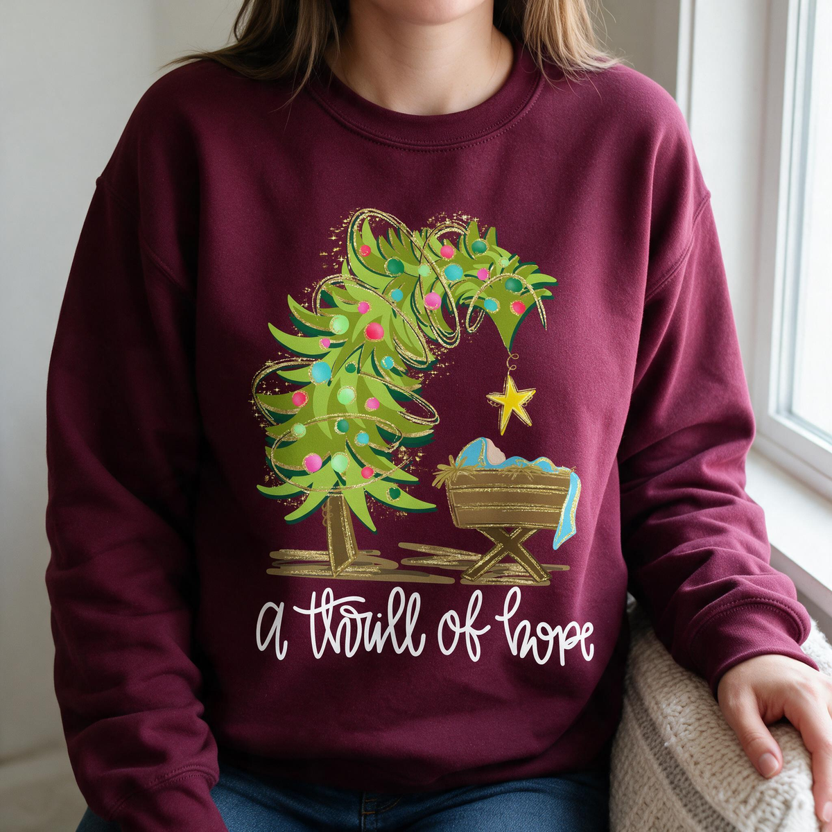 Model wearing the Nativity Scene sweatshirt in Maroon