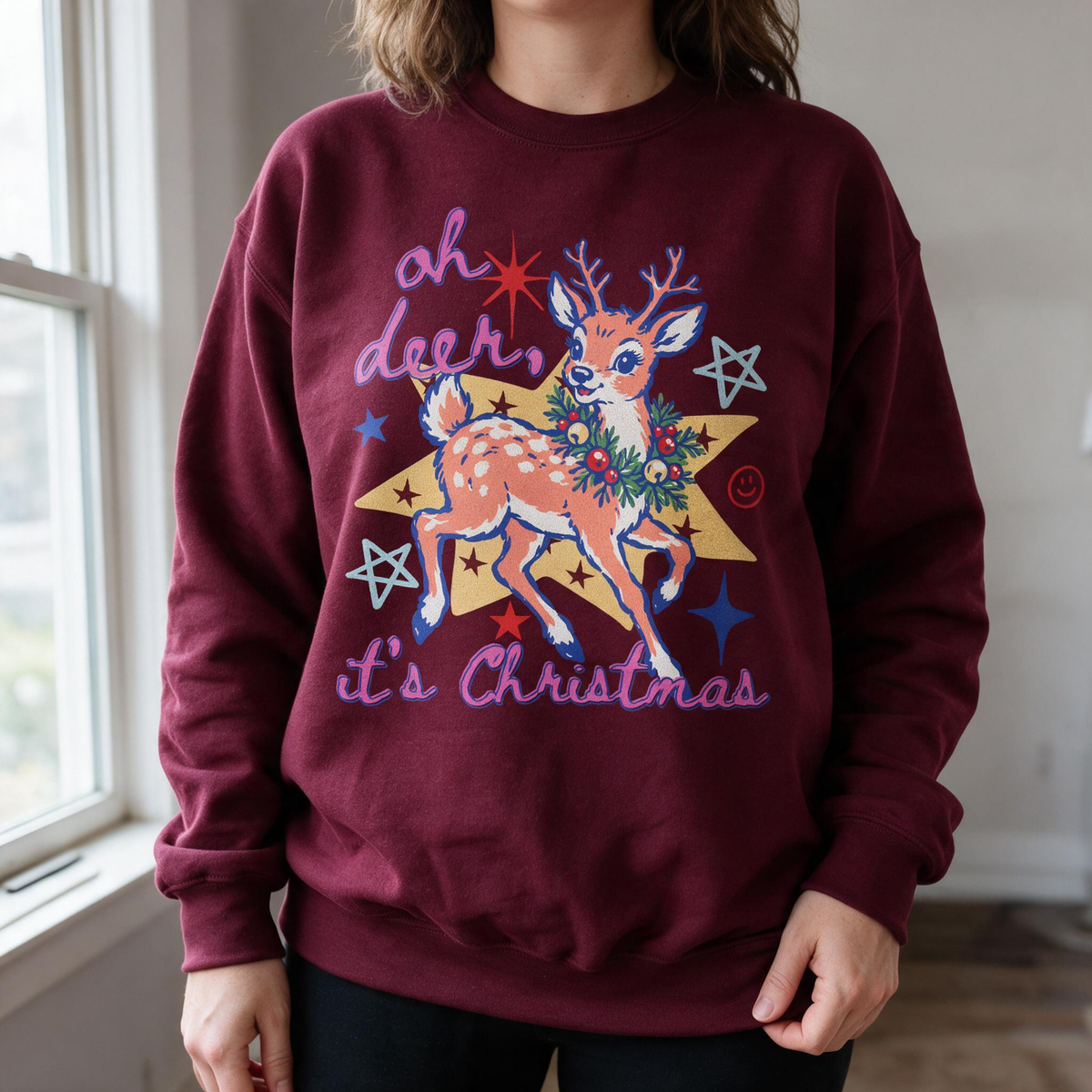 Model wearing the Oh Deer It's Christmas sweatshirt in Maroon