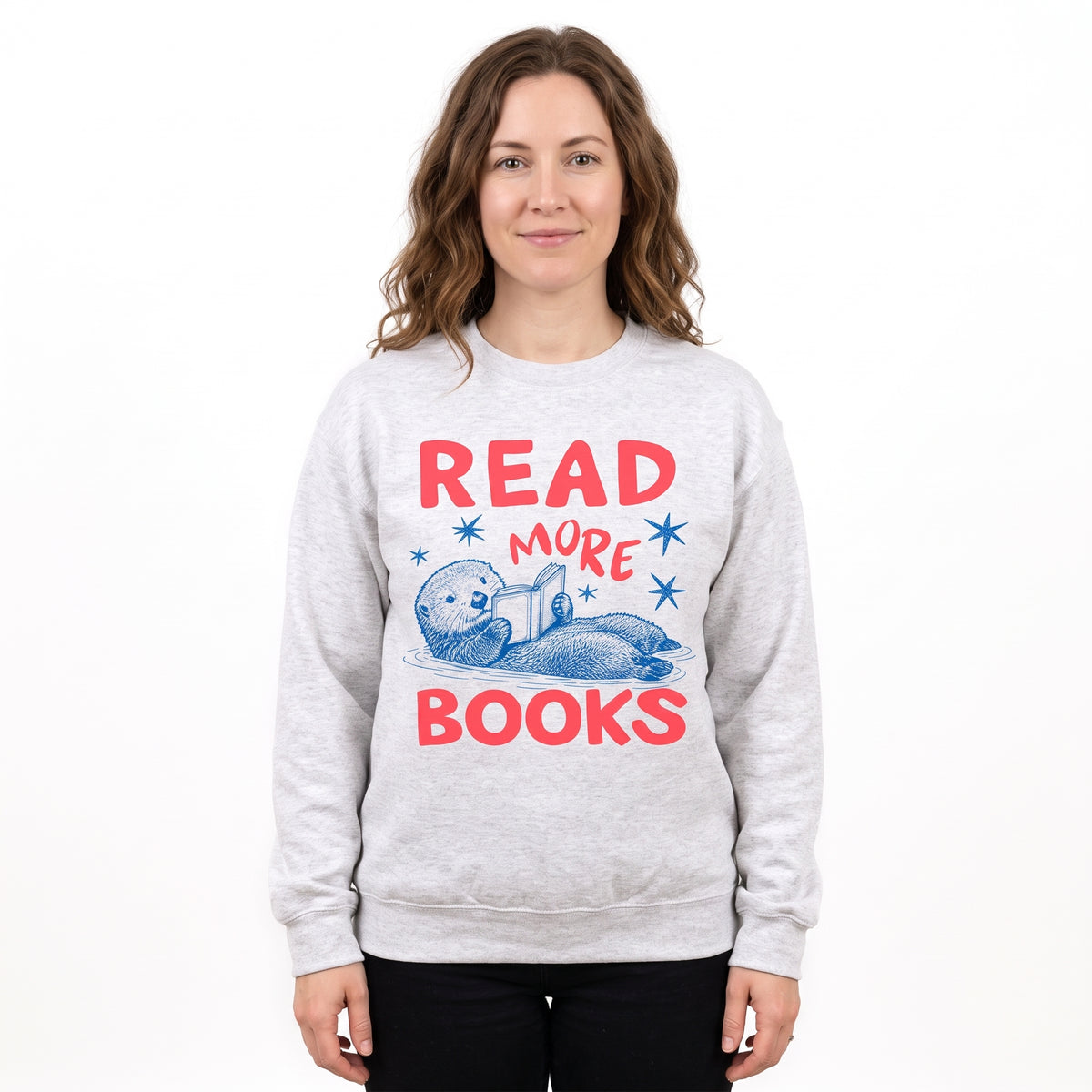 Model wearing the Otter Reading Book sweatshirt in Ash, cover image 1