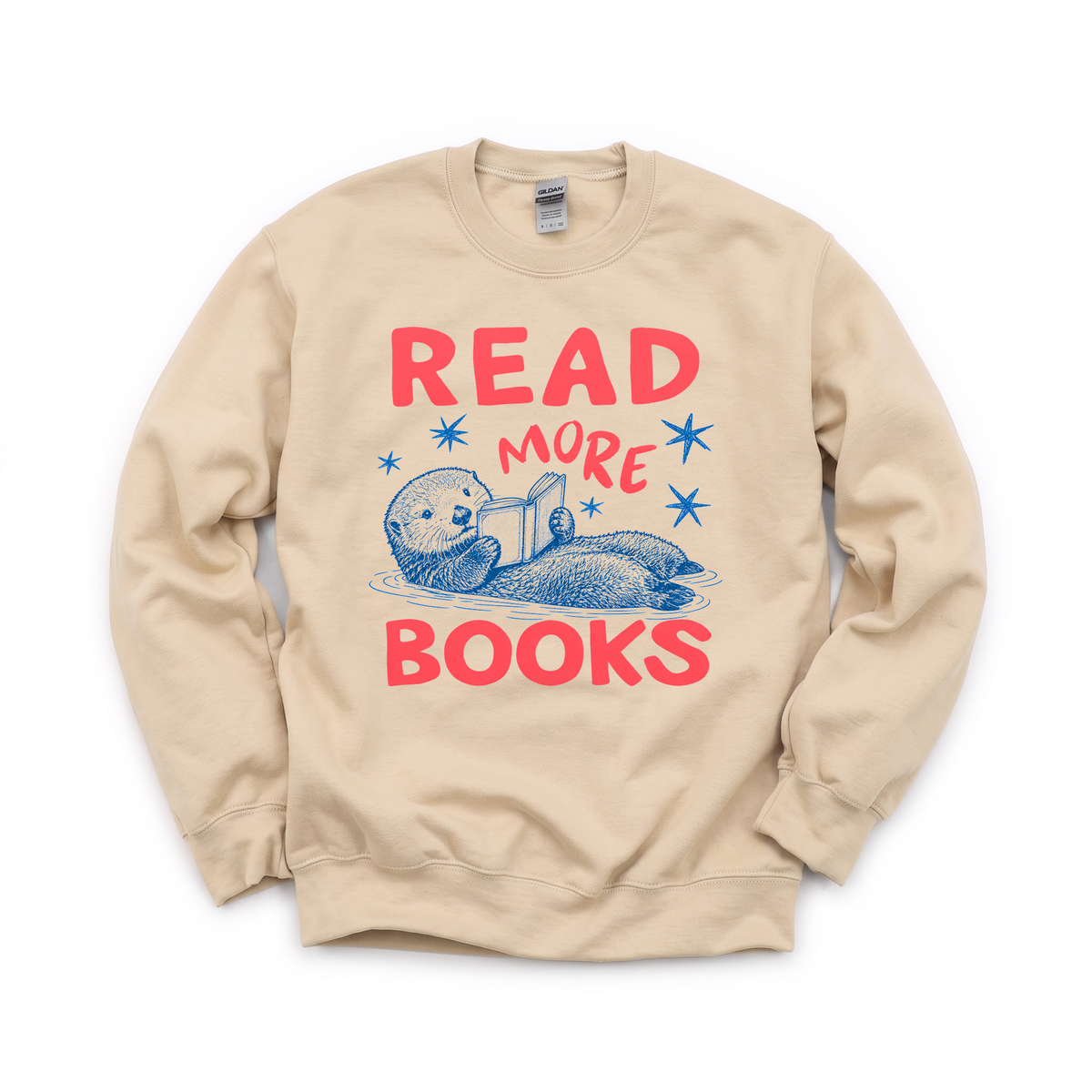 Otter Reading Book graphic on Gildan 18000 in Sand
