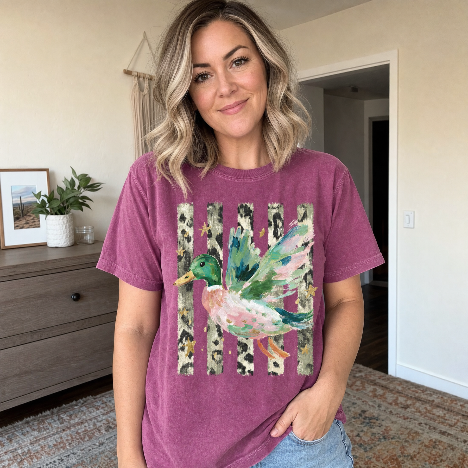 Model wearing the Painted Duck comfort colors tee in Berry