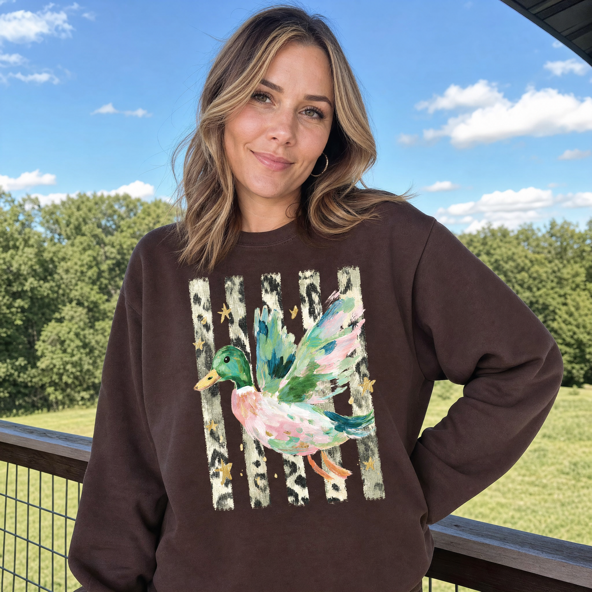 Model wearing the Painted Duck sweatshirt in Dark Chocolate