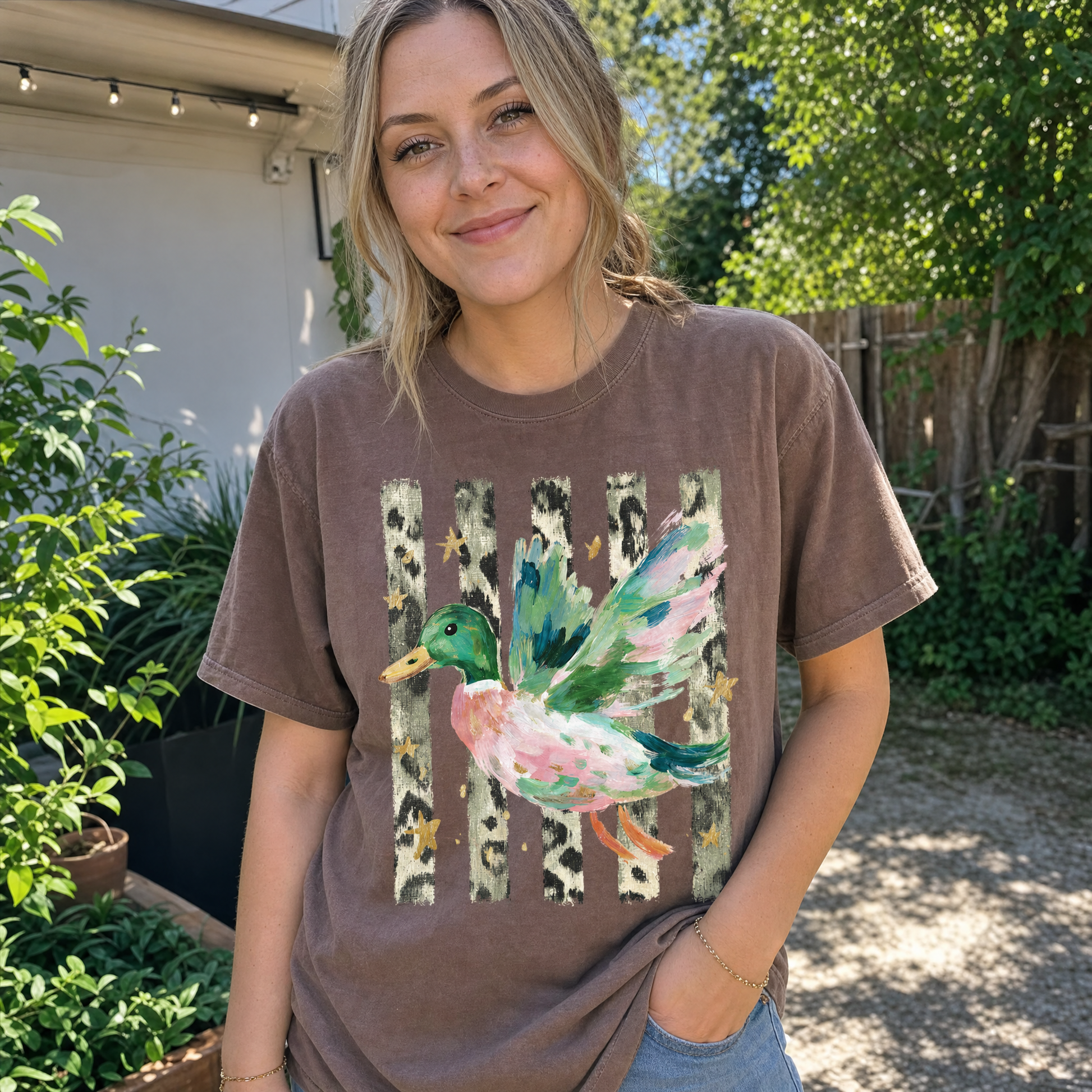 Model wearing the Painted Duck comfort colors tee in Espresso