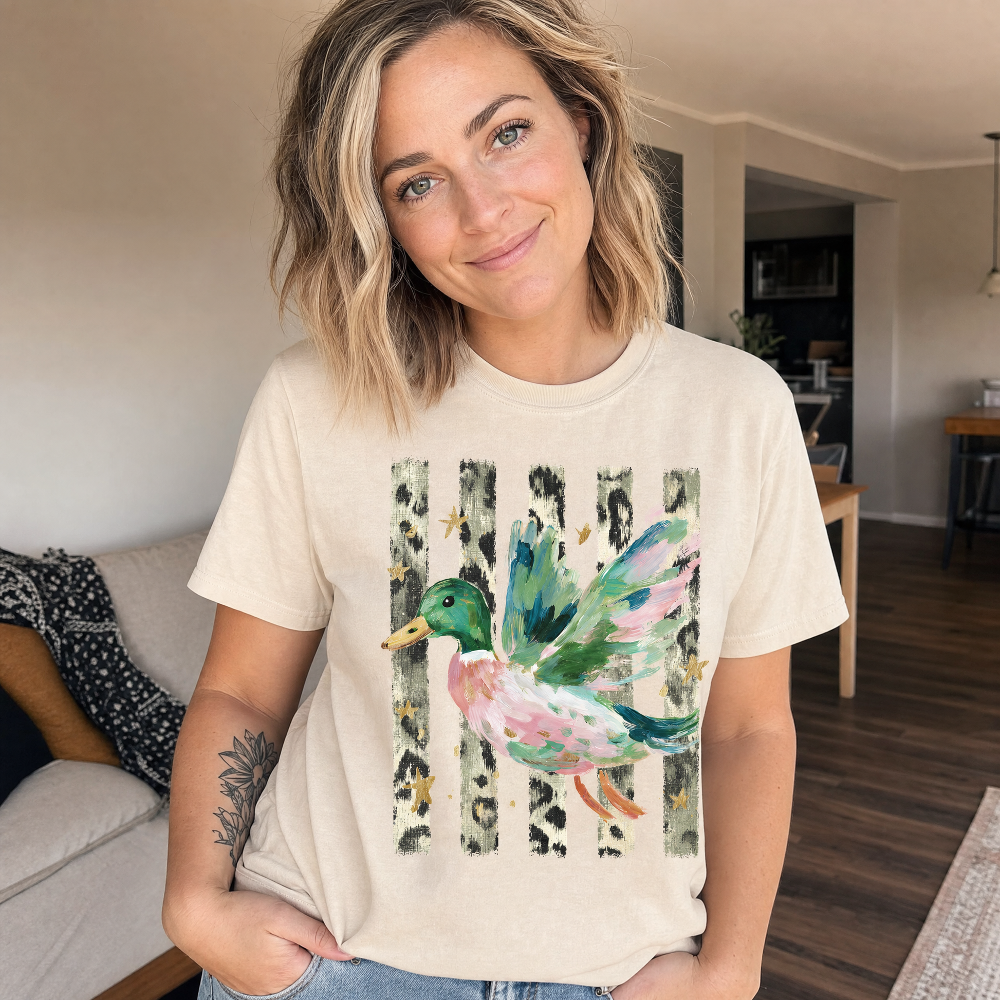 Model wearing the Painted Duck comfort colors tee in Ivory