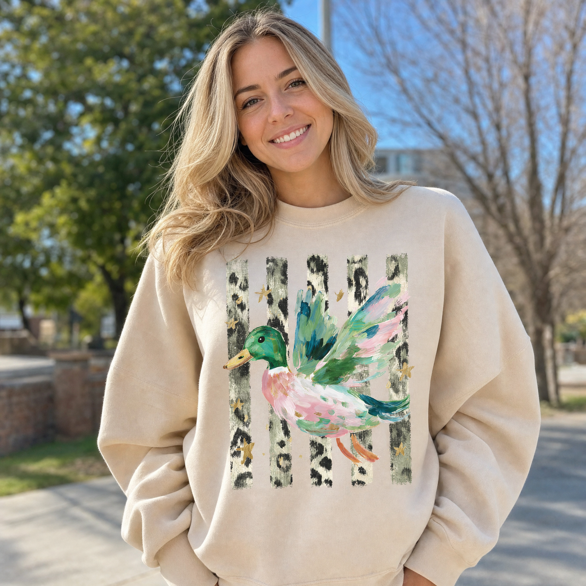 Model wearing the Painted Duck sweatshirt in Sand