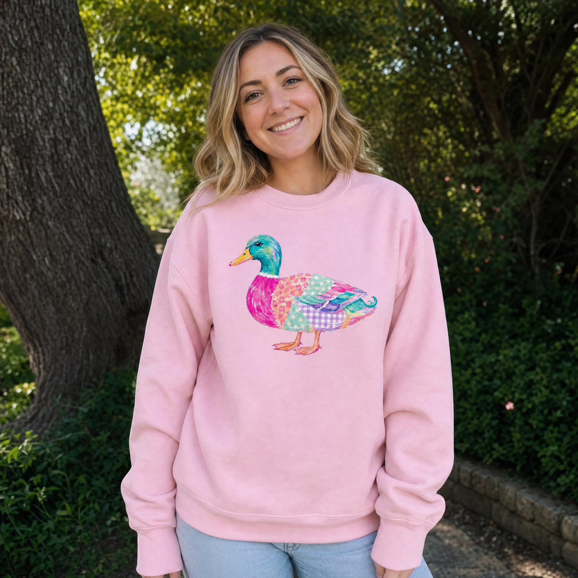 Model wearing the Patchwork Duck sweatshirt in Light Pink