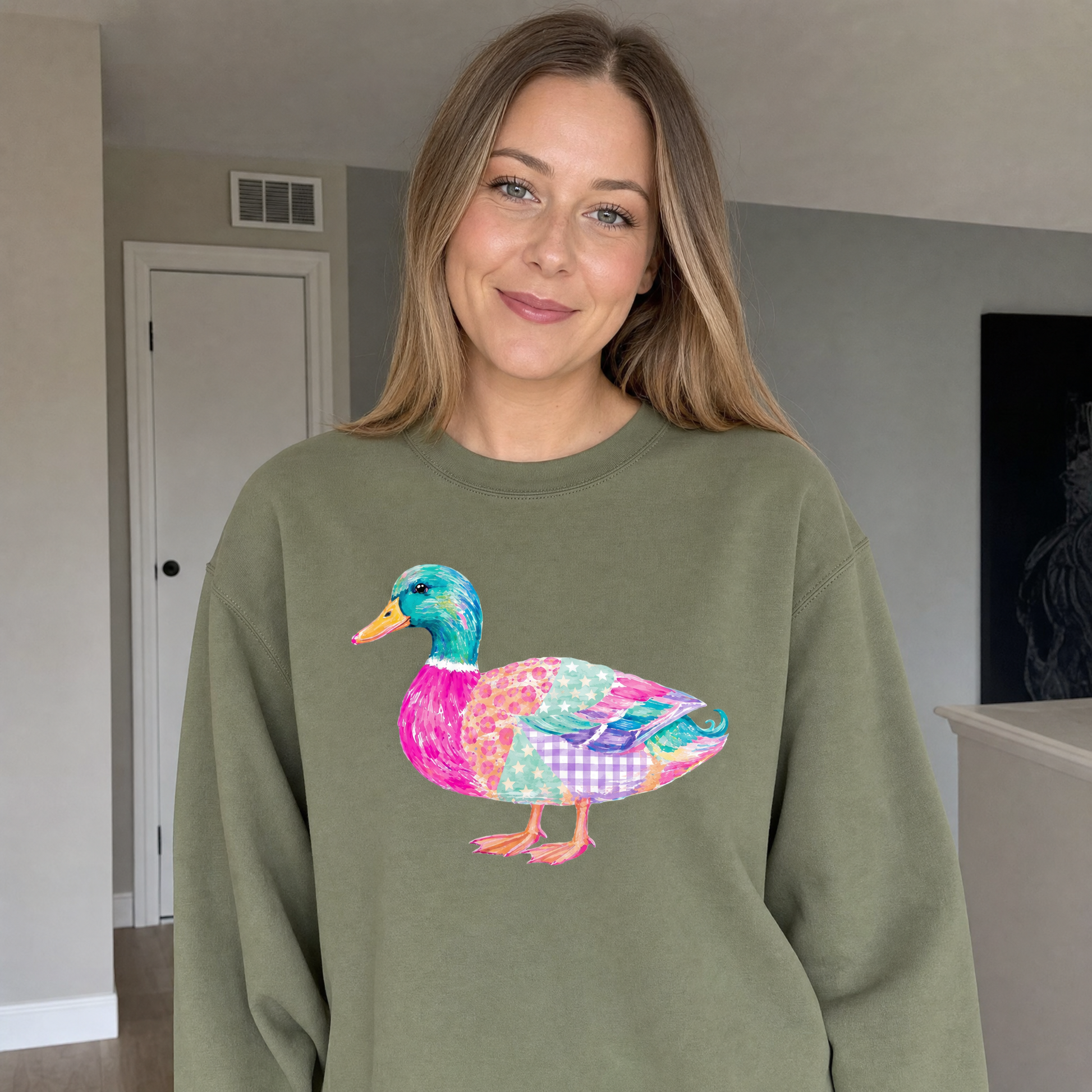 Model wearing the Patchwork Duck sweatshirt in Military Green