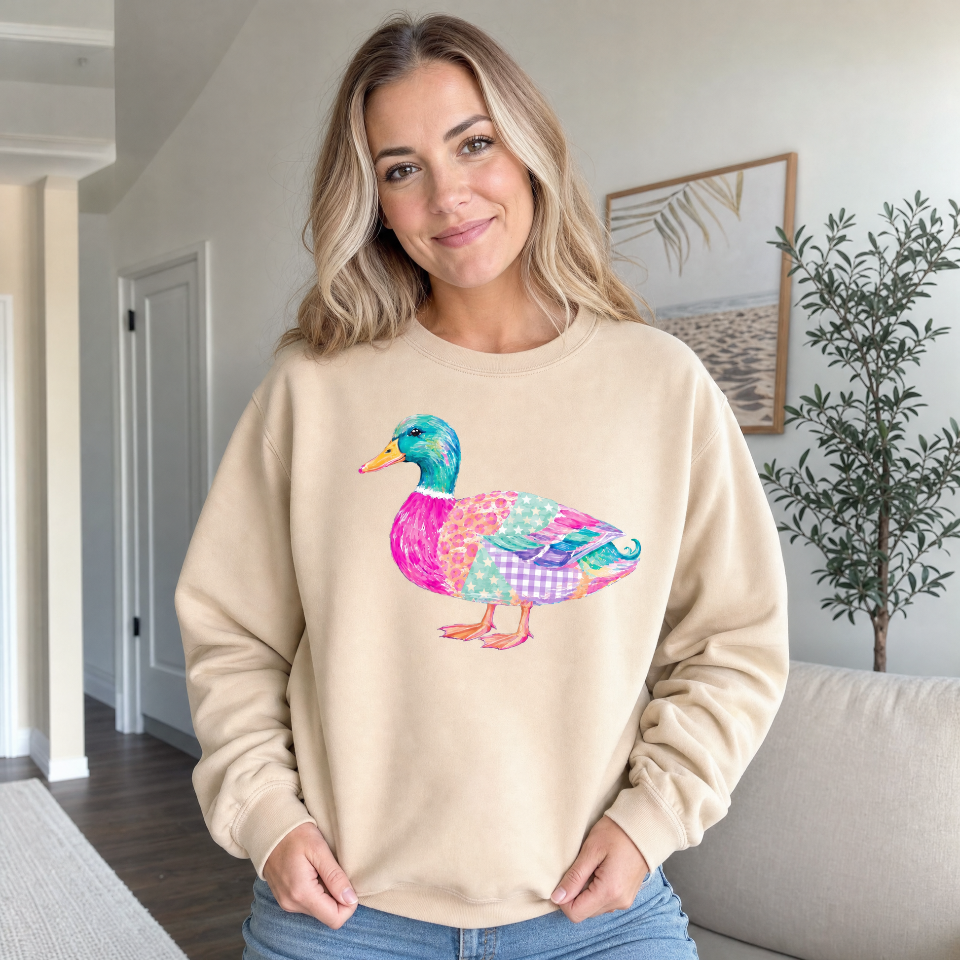 Model wearing the Patchwork Duck sweatshirt in Sand