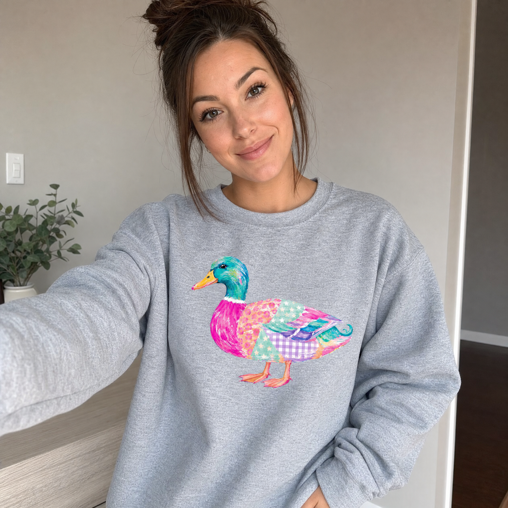 Model wearing the Patchwork Duck sweatshirt in Sport Grey