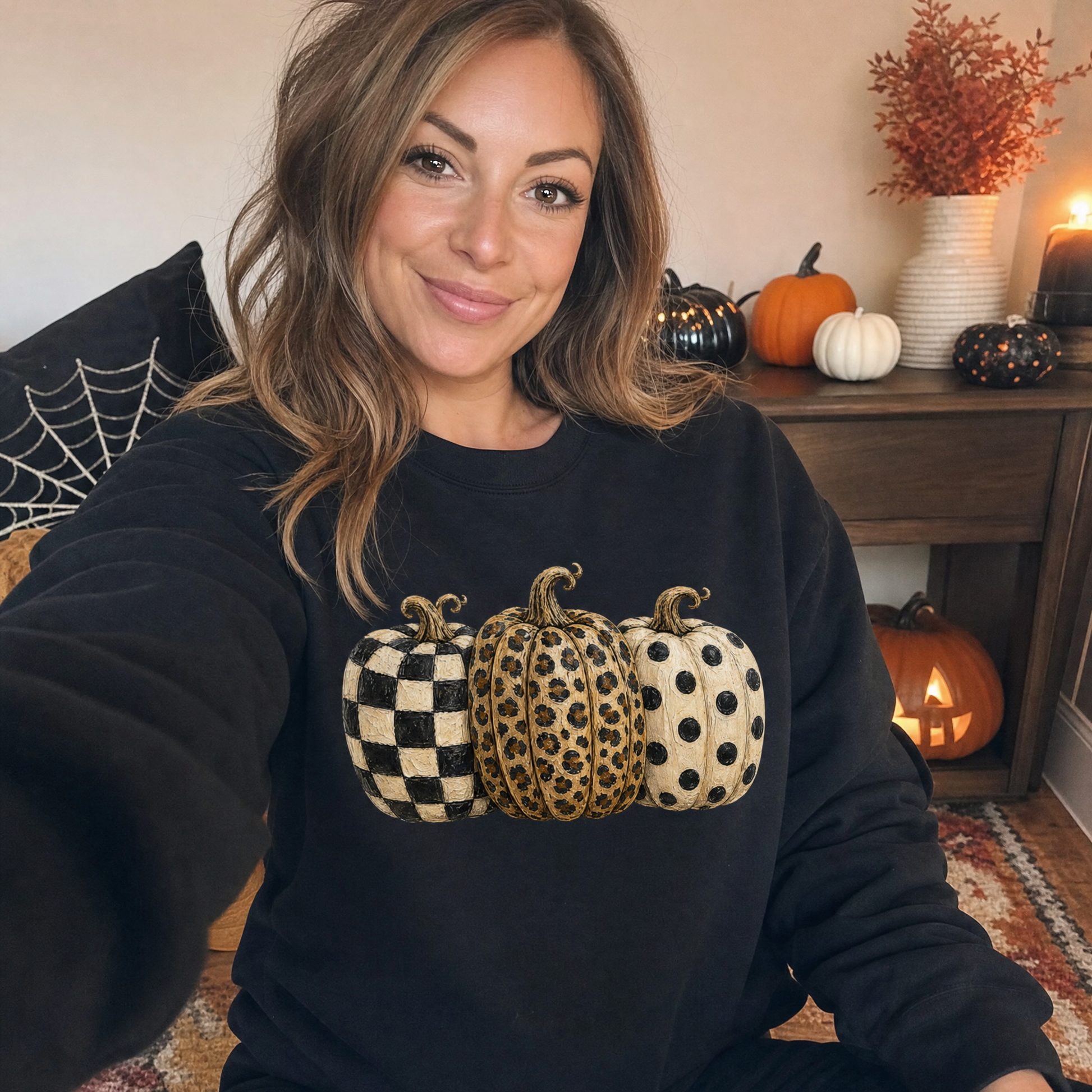 Model wearing the Patterned Pumpkins sweatshirt in Black