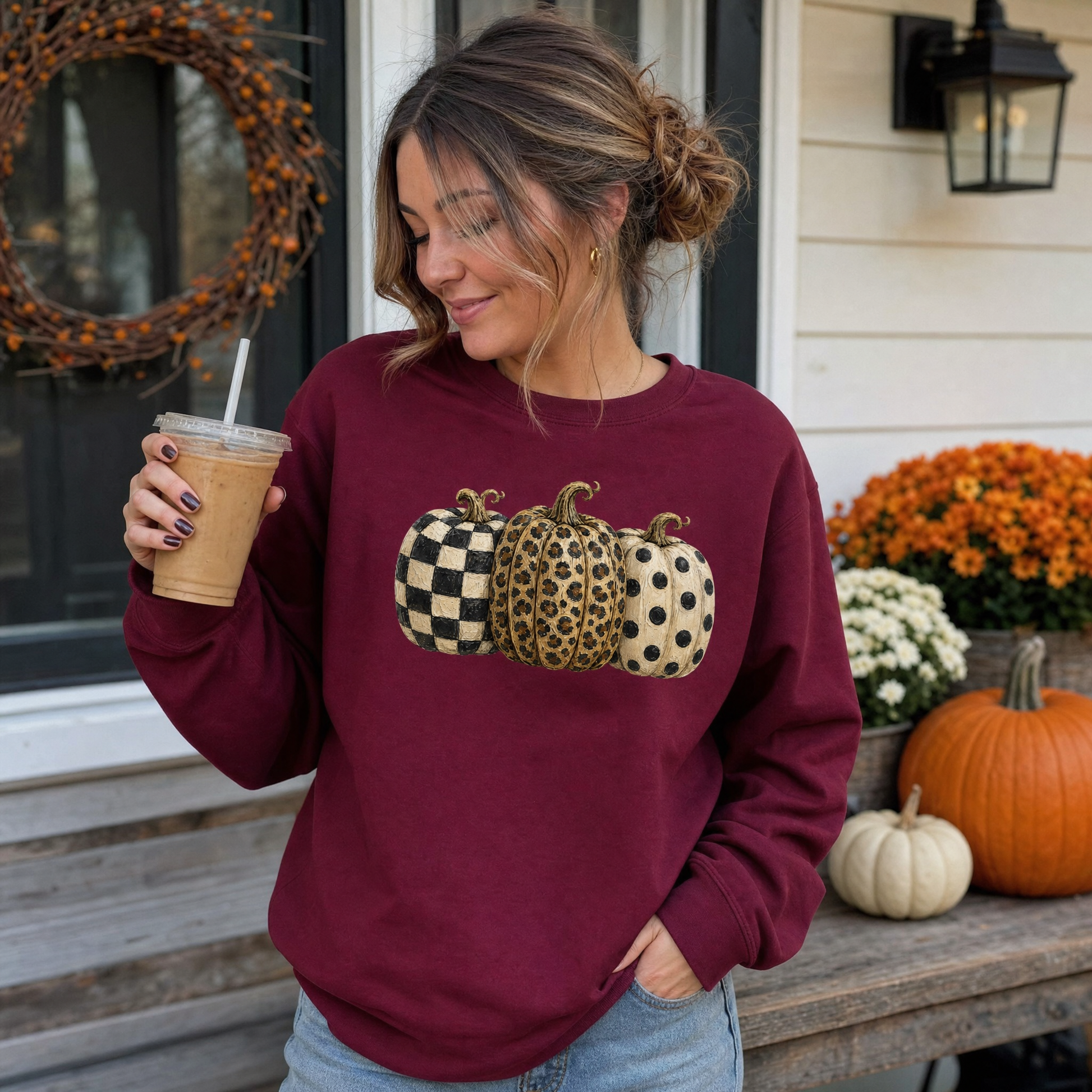 Model wearing the Patterned Pumpkins sweatshirt in Maroon