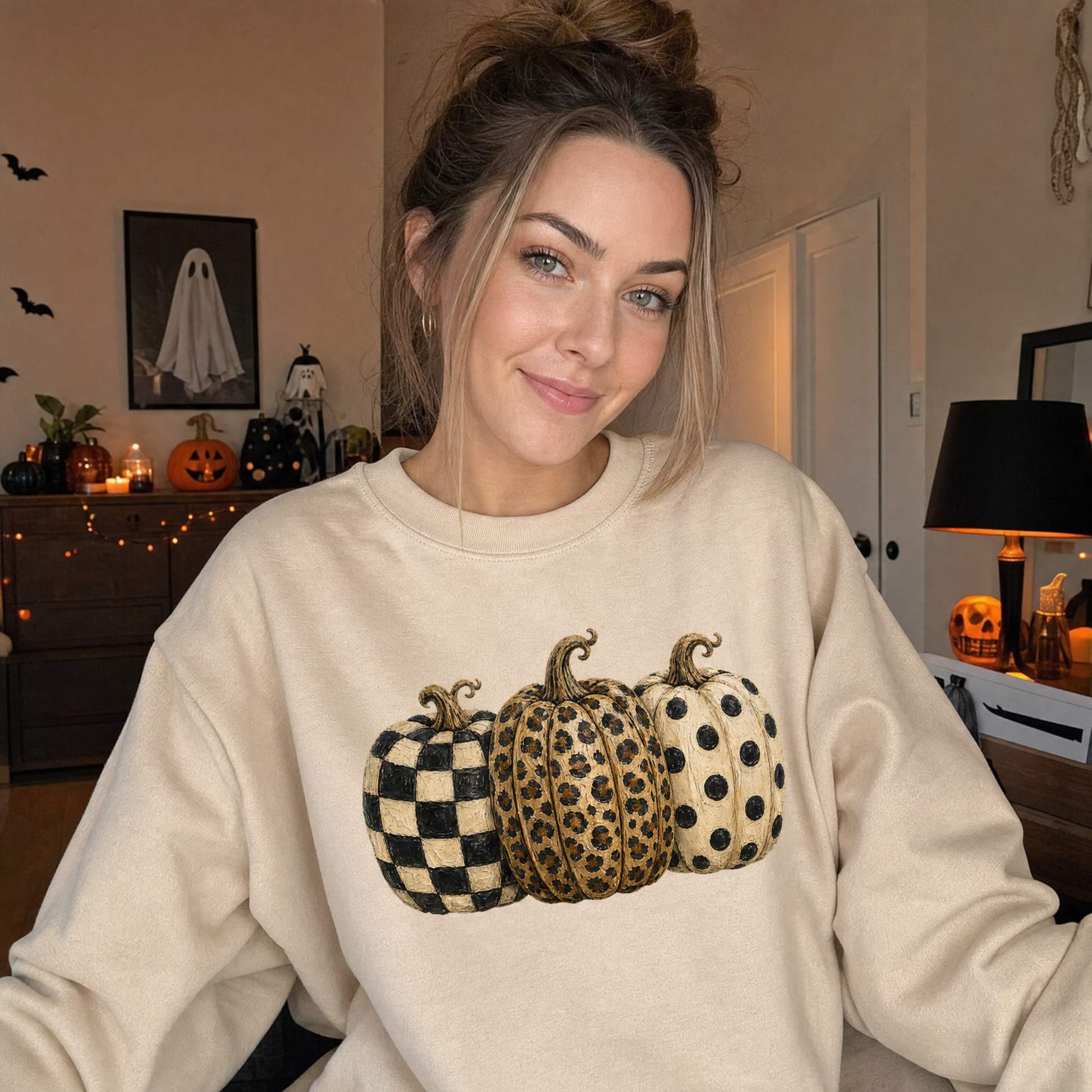 Model wearing the Patterned Pumpkins sweatshirt in Sand