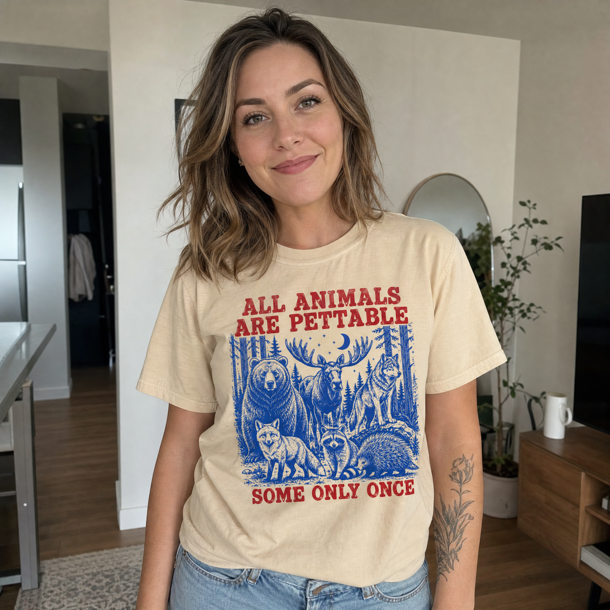 Model wearing the Pettable Animals comfort colors tee in Butter
