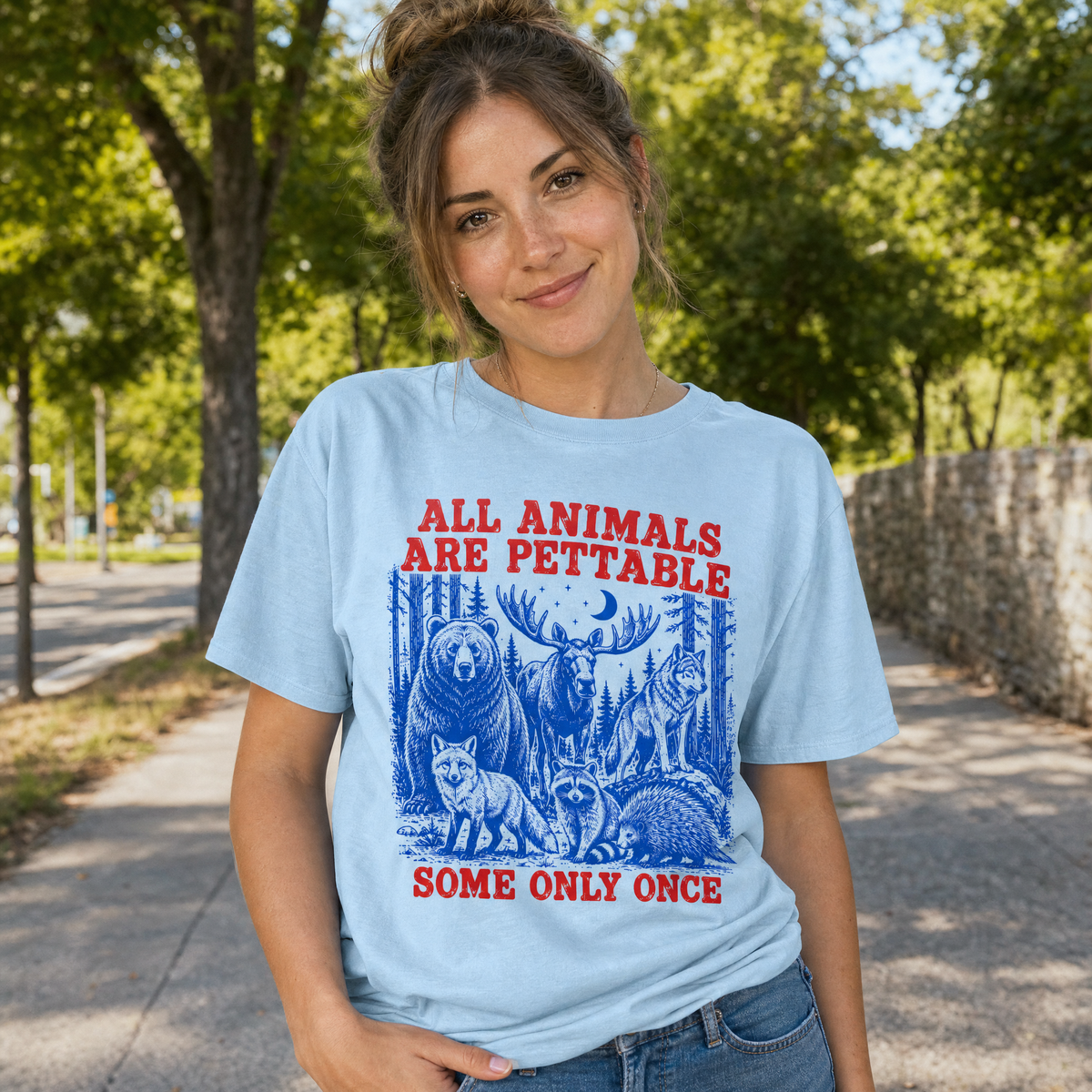 Model wearing the Pettable Animals comfort colors tee in Chambray