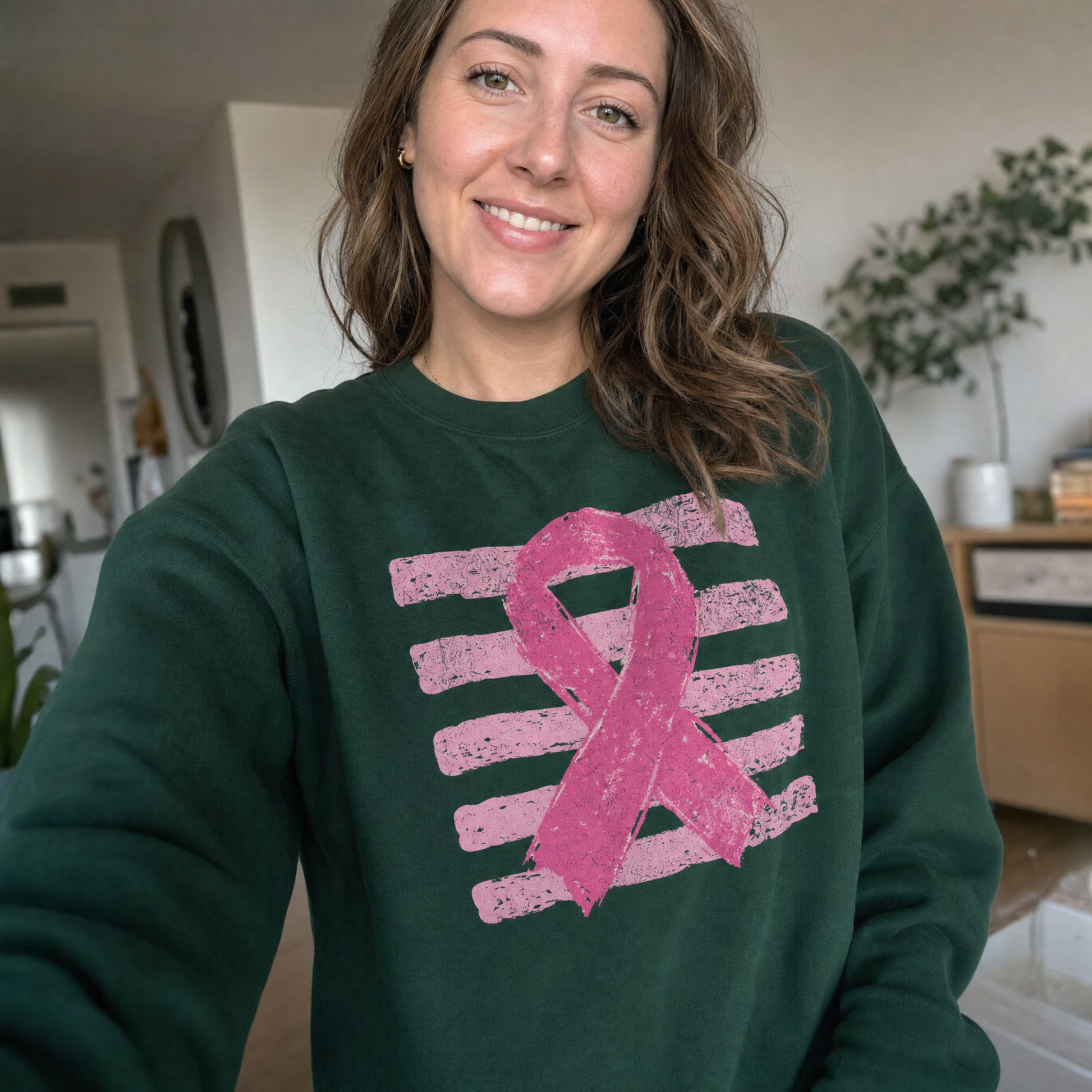 Model wearing the Pink Out sweatshirt in Forest Green