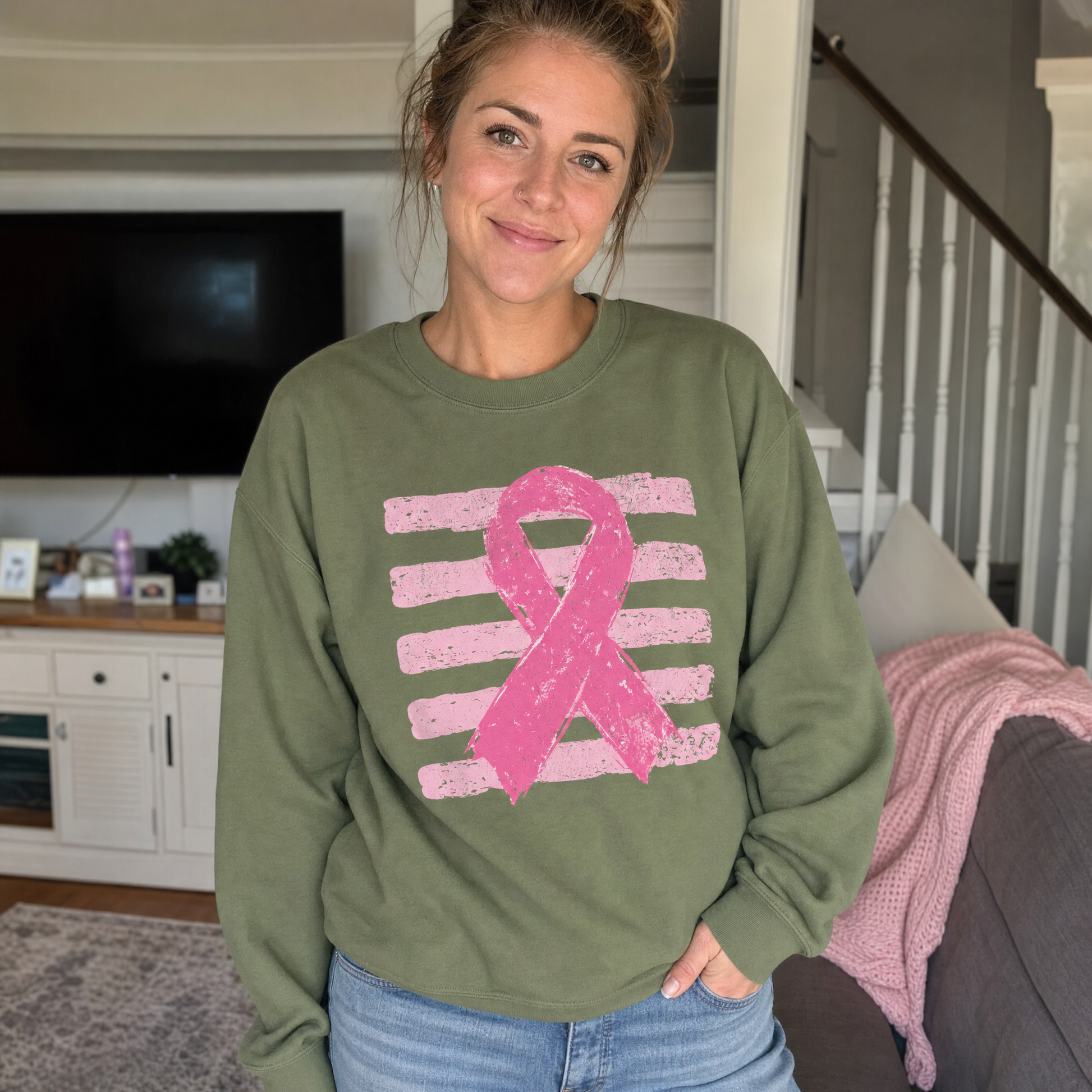 Model wearing the Pink Out sweatshirt in Military Green