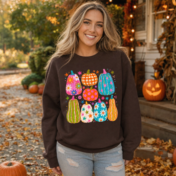 Model wearing the Playful Pumpkins sweatshirt in Dark Chocolate