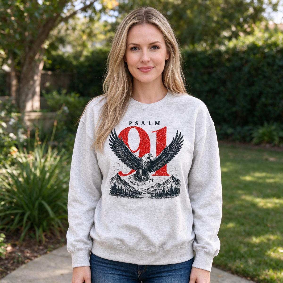 Model wearing the Psalm 91 Eagle sweatshirt in Ash, lifestyle image 1