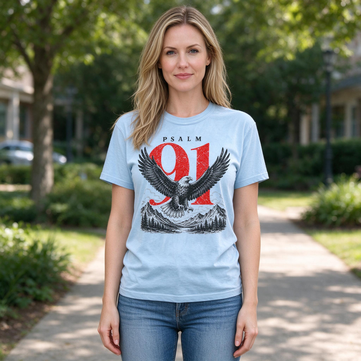 Model wearing the Psalm 91 Eagle comfort colors tee in Chambray