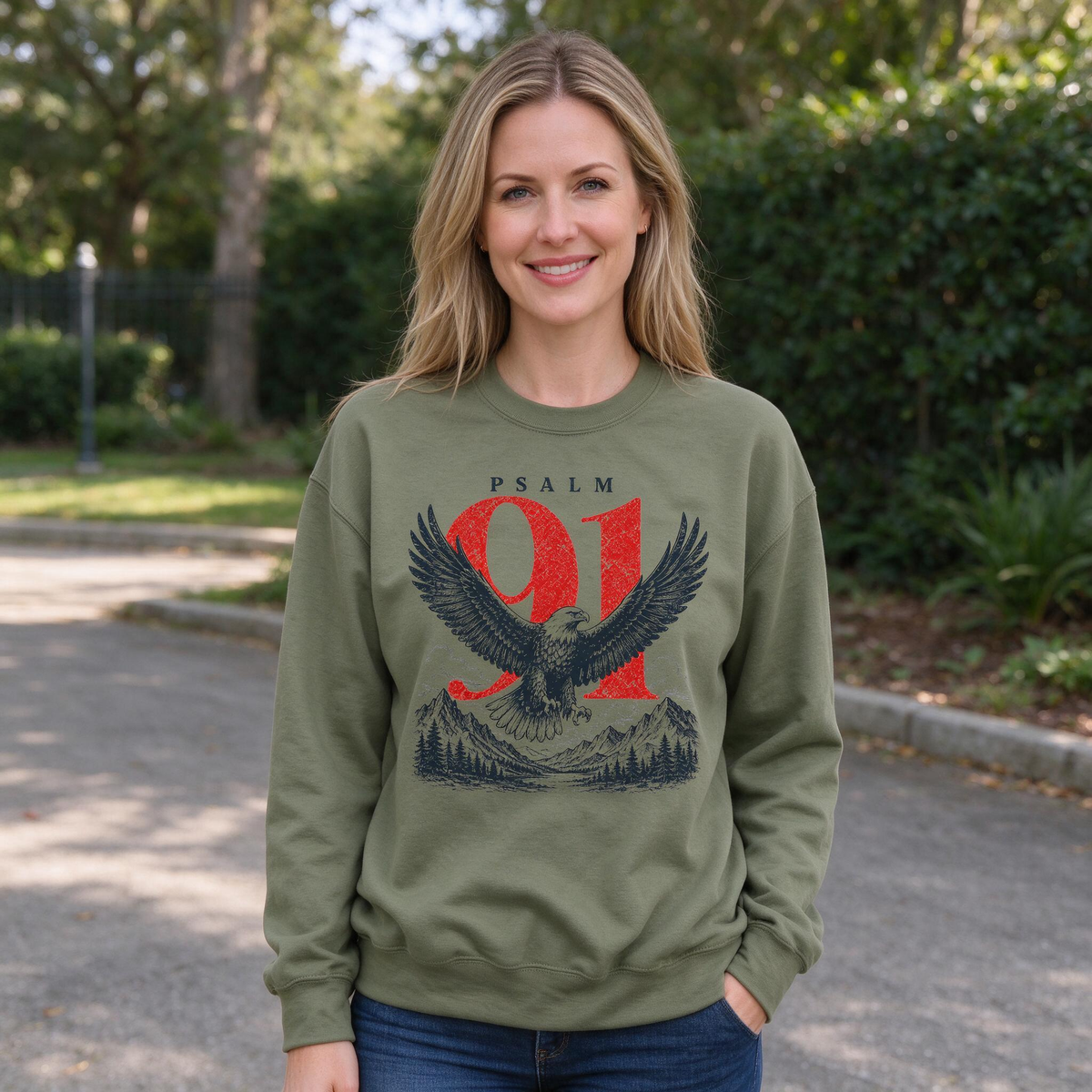 Model wearing the Psalm 91 Eagle sweatshirt in Military Green