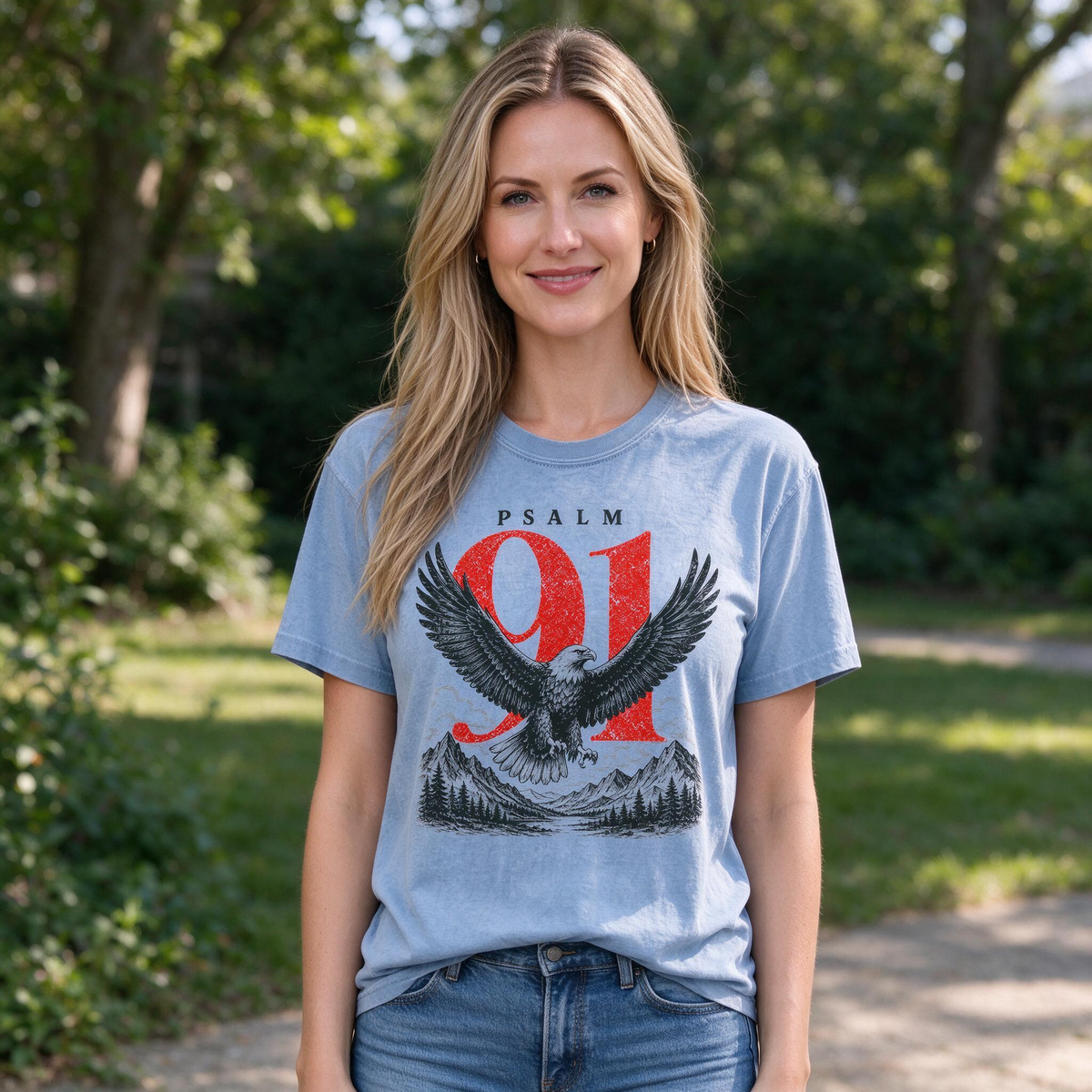 Model wearing the Psalm 91 Eagle comfort colors tee in Washed Denim