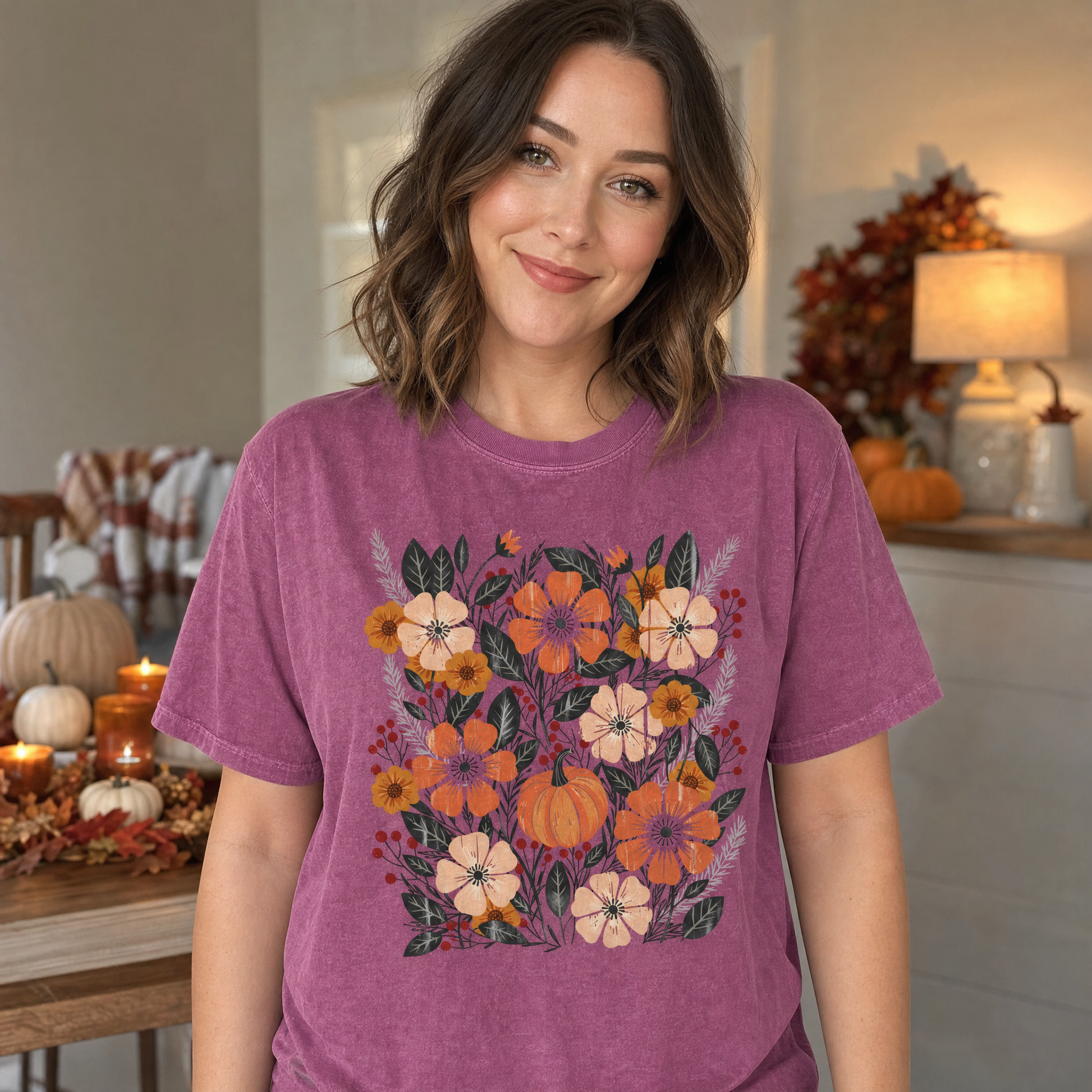 Model wearing the Pumpkin Patch Blooms comfort colors tee in Berry