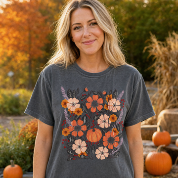 Model wearing the Pumpkin Patch Blooms comfort colors tee in Pepper