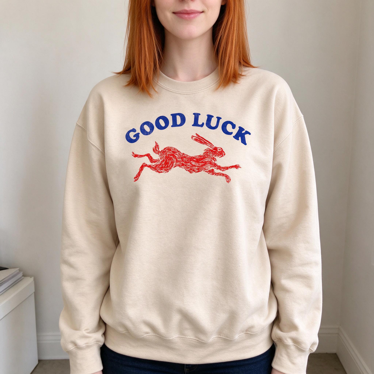 Model wearing the Running Rabbit sweatshirt in Sand